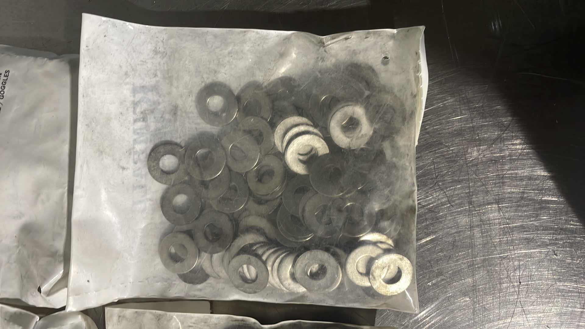 Photo 1 of 1/4" STAINLESS FLAT WASHER,5/8" OUTSIDE DIAMETER,18-8 (304) STAINLESS STEEL 4-100CT