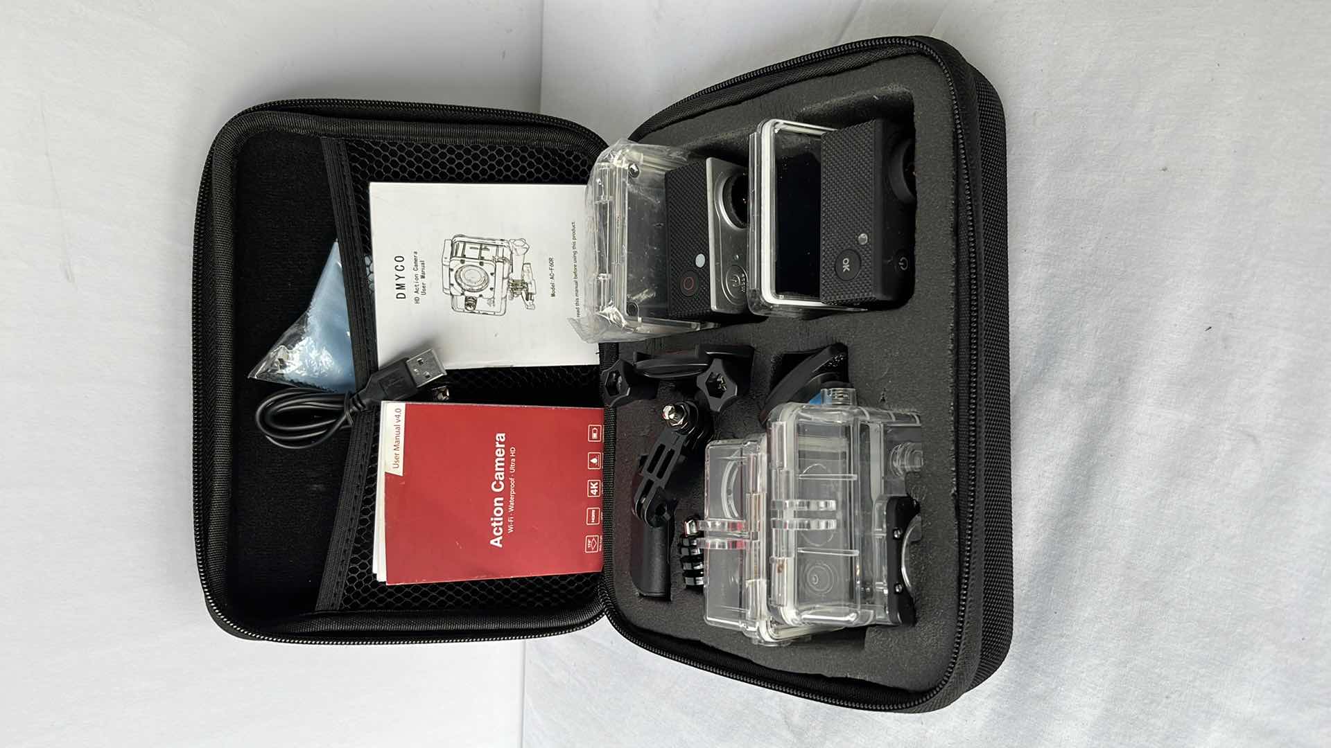 Photo 1 of DYMCO 4K ULTRA HD ACTION CAMERA (MODEL AC-F60R) & v4.0 4K ULTRA HD ACTION CAMERA INCLUDES CASE WITH ACCESSORIES