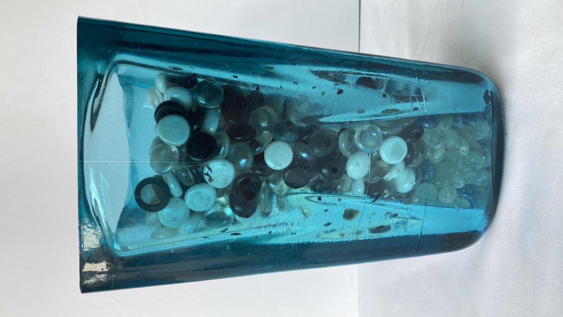 Photo 1 of TEAL CLEAR GLASS VASE W MARBLES 6.5” X 6.5” H11”