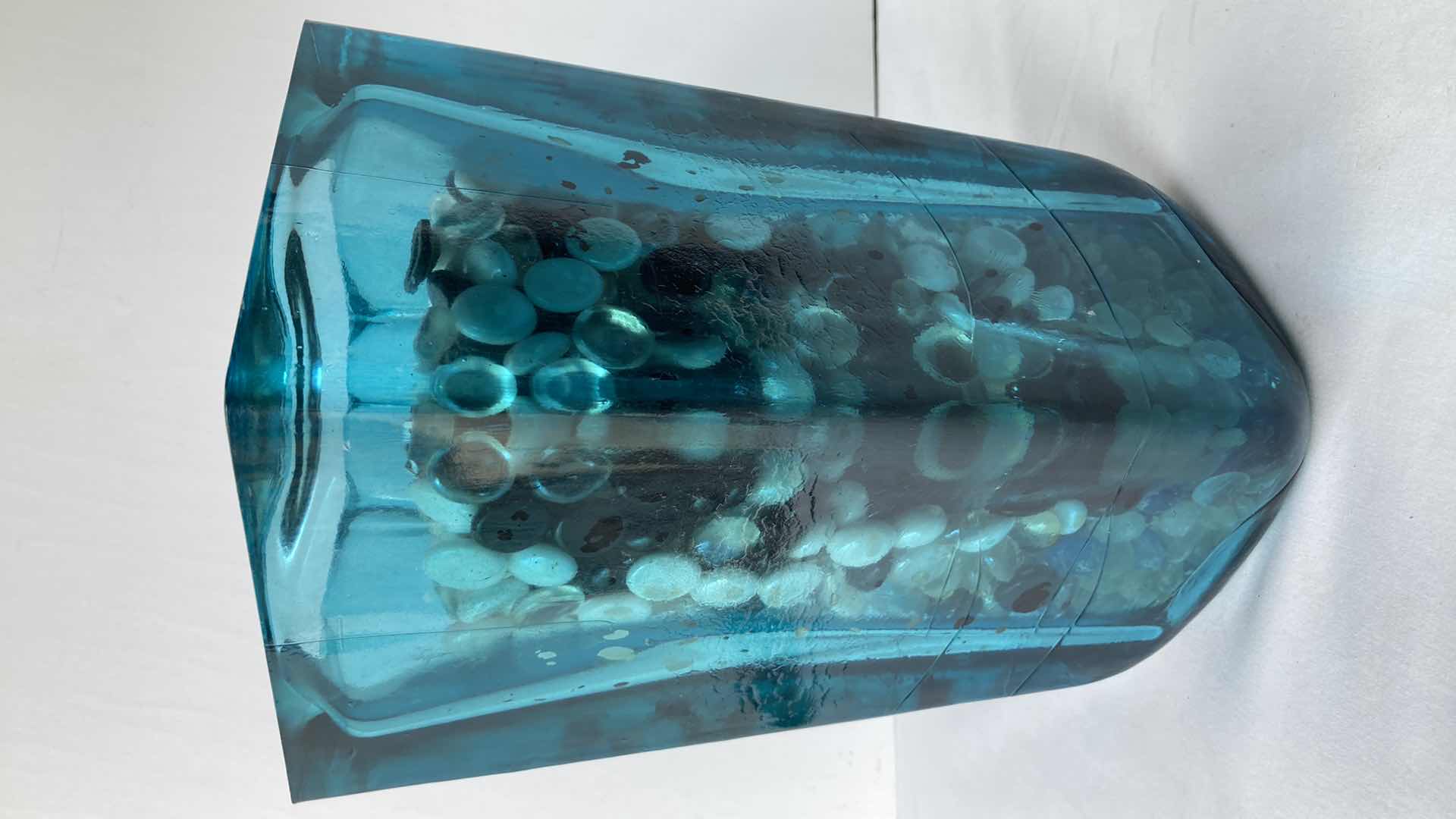 Photo 1 of TEAL CLEAR GLASS VASE W MARBLES 6.5” X 6.5” H11”