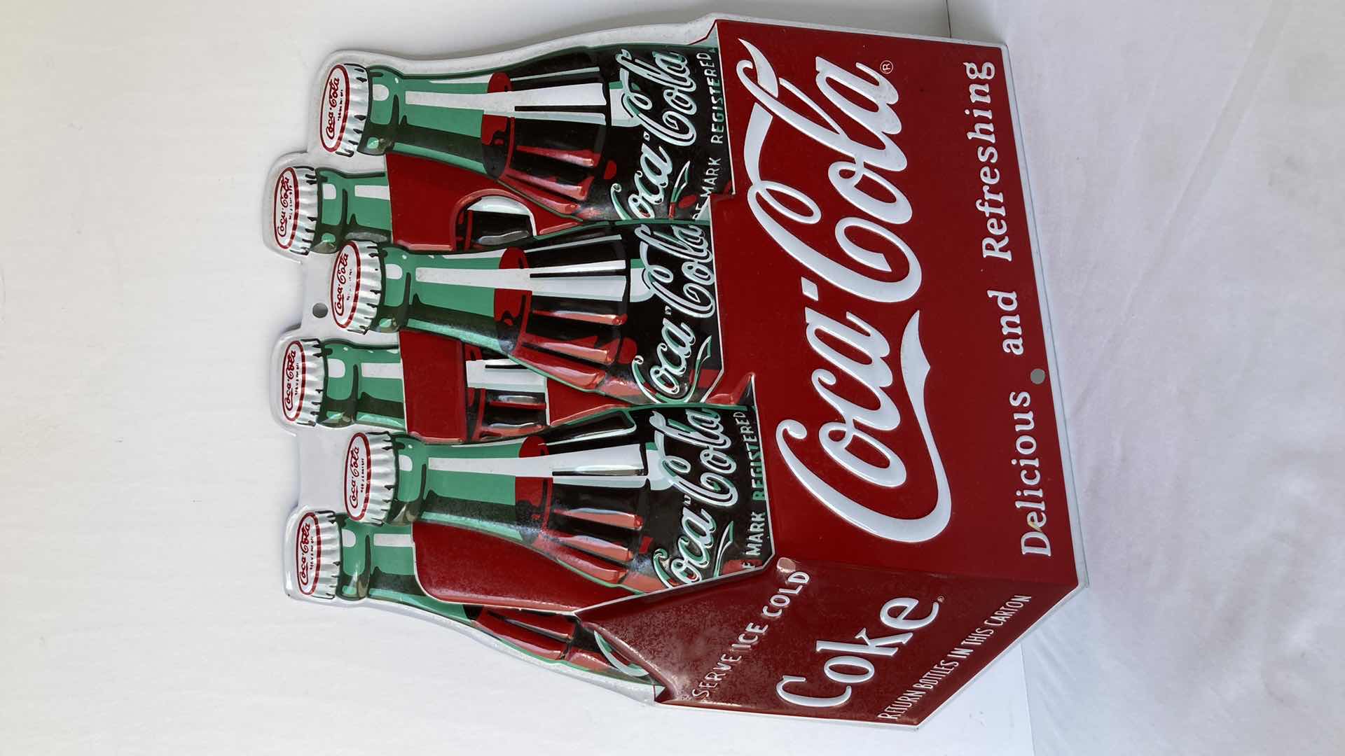 Photo 1 of COCA-COLA CARTON DIE CUT TIN SIGN 12” X 13”