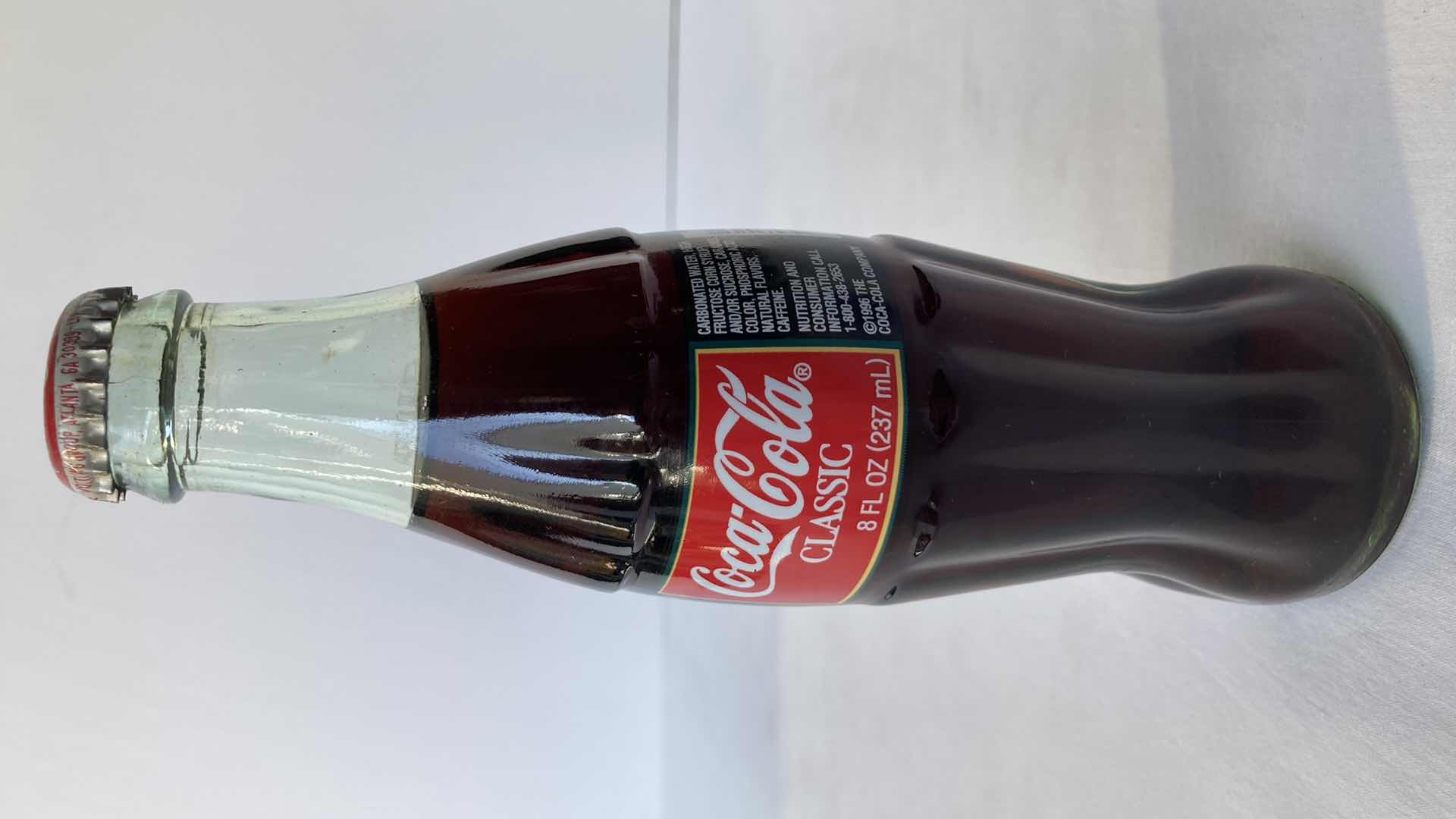 Photo 1 of NEW COCA-COLA RED ALUMINUM 8.5OZ FULL BOTTLE & COCA-COLA CHRISTMAS 1996 8OZ FULL BOTTLE