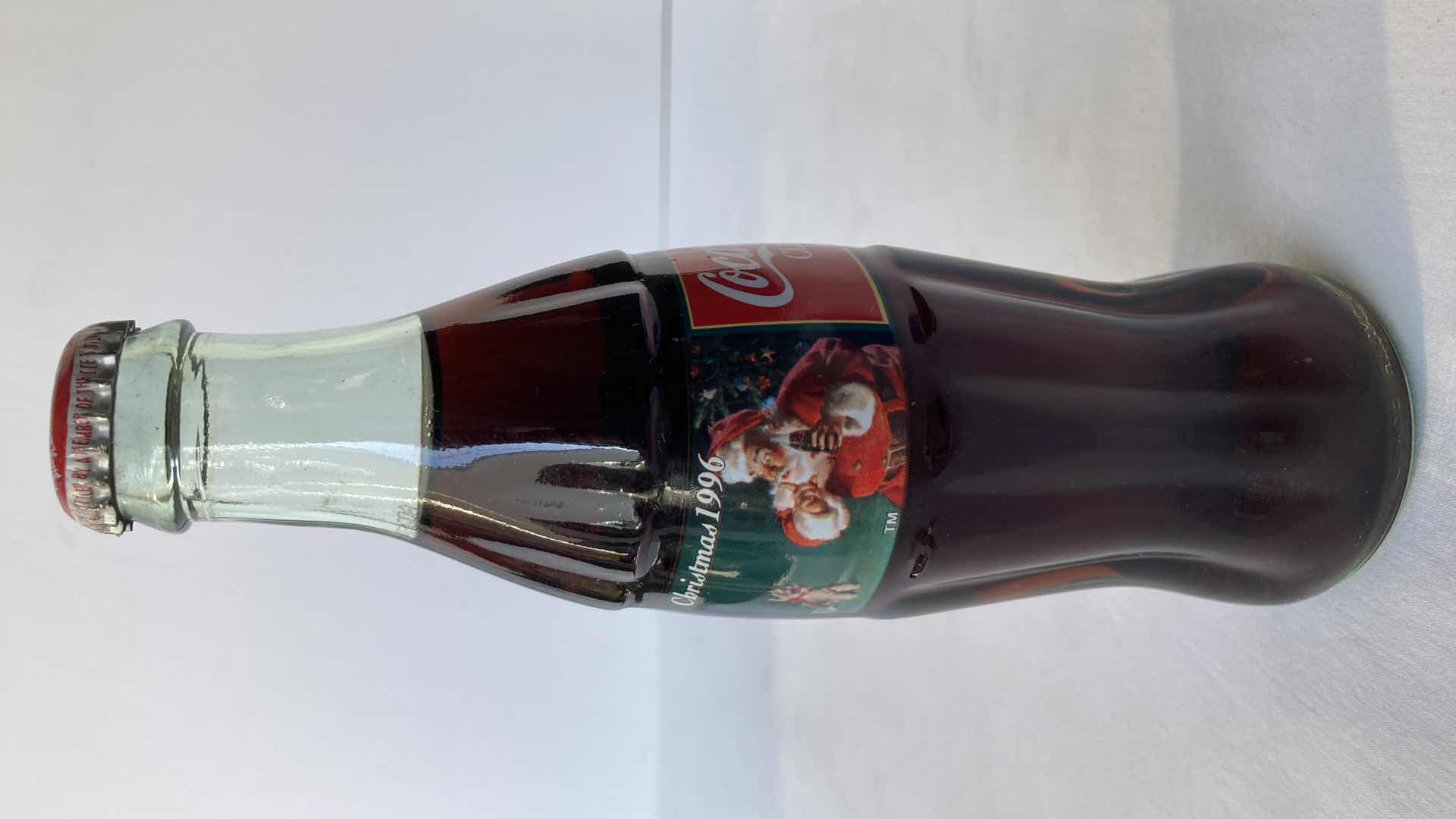 Photo 1 of NEW COCA-COLA RED ALUMINUM 8.5OZ FULL BOTTLE & COCA-COLA CHRISTMAS 1996 8OZ FULL BOTTLE