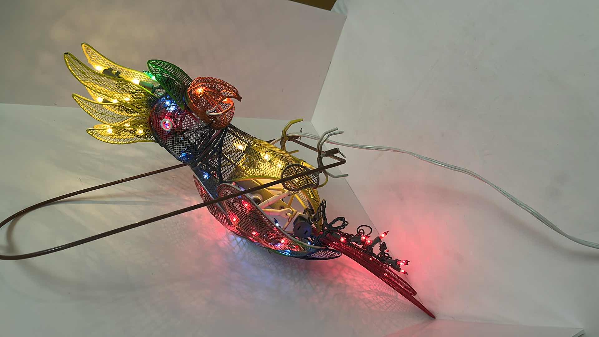 Photo 1 of AUTOMATED LIGHT-UP METAL HANGING PARROT