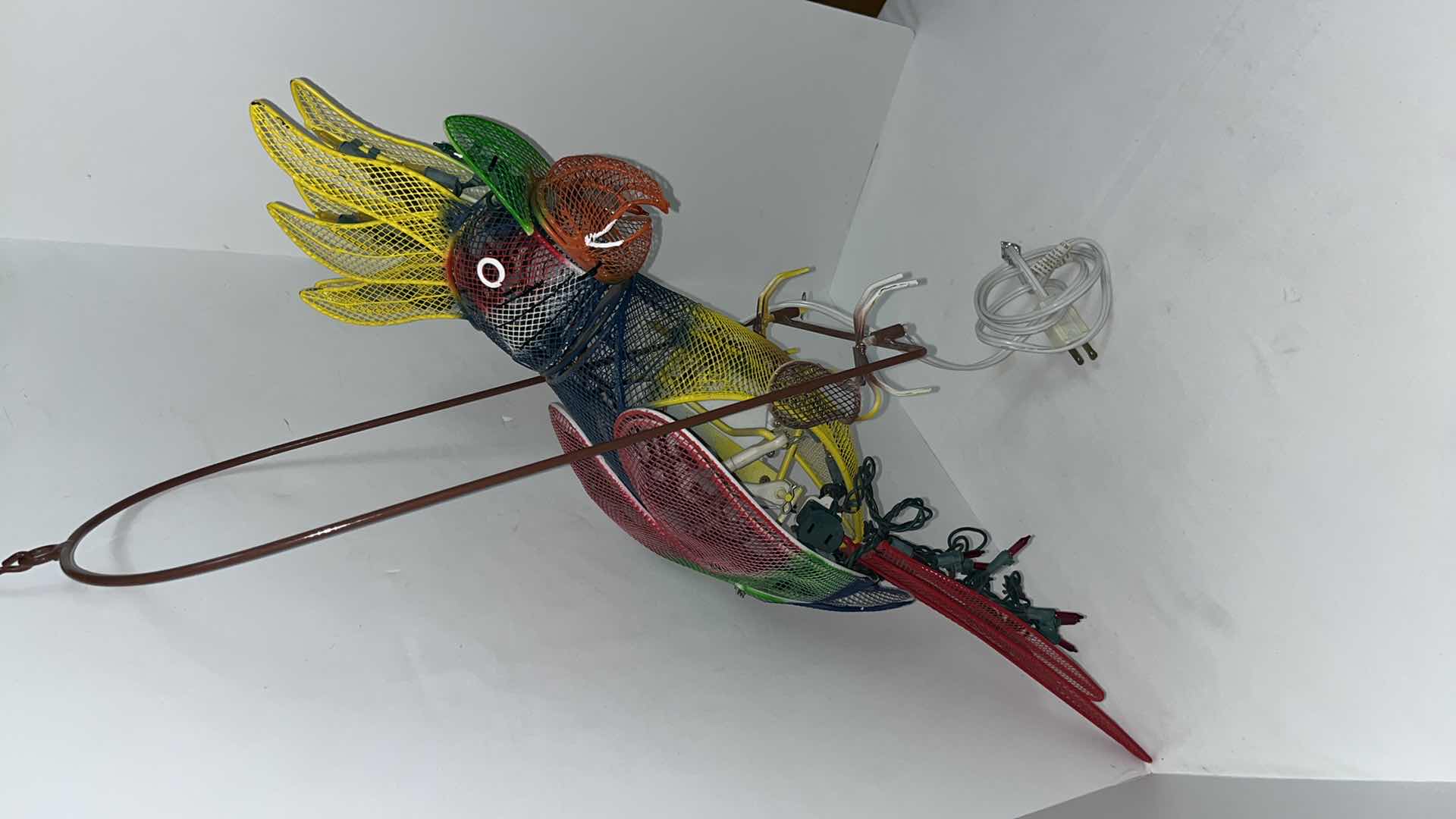 Photo 1 of AUTOMATED LIGHT-UP METAL HANGING PARROT