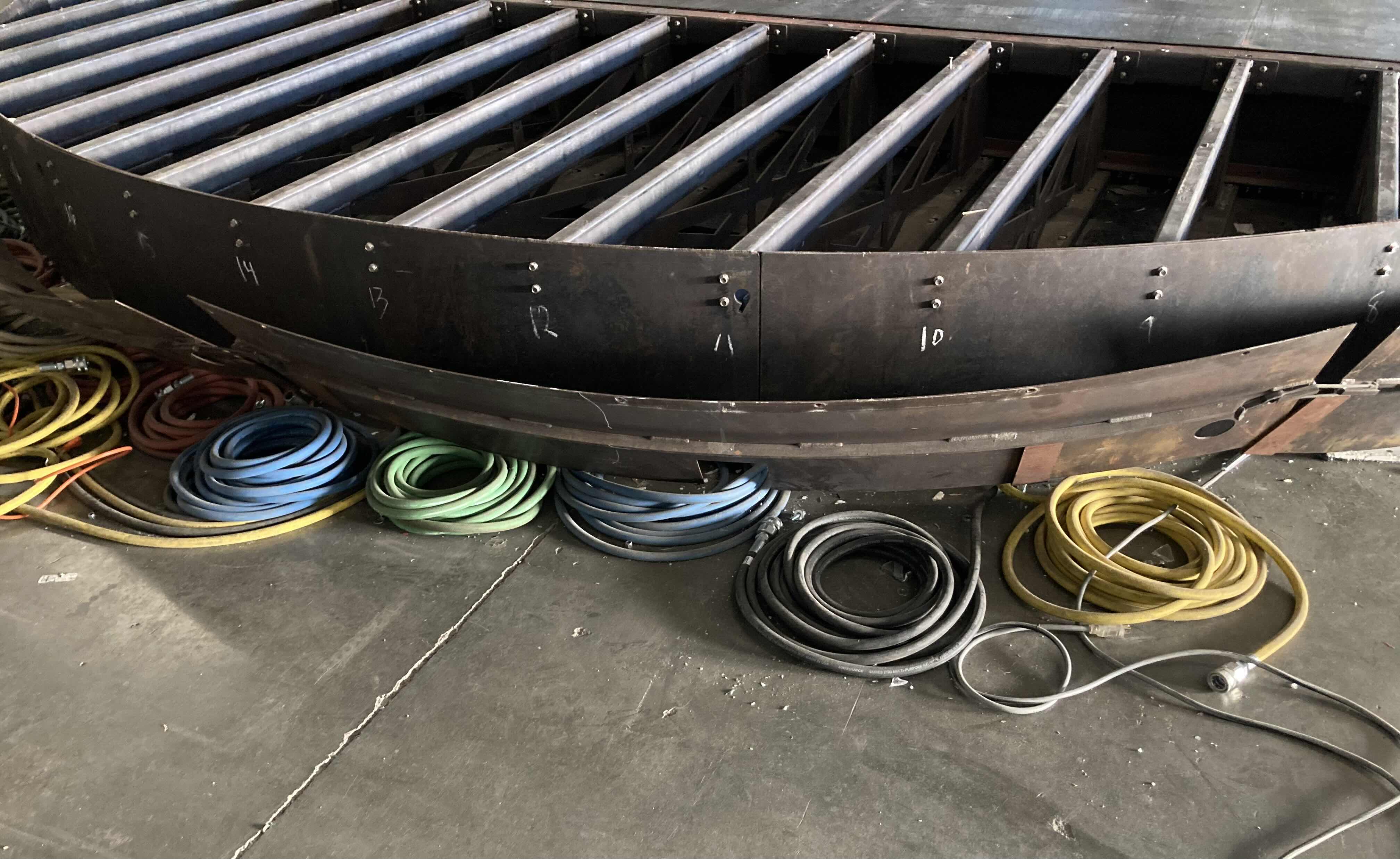 Photo 1 of CUSTOM FABRICATED HEAVY-DUTY STEEL AIR HOSE OPERATED VEHICLE PLATFORM W 19 AIR HOSES FOR BAG LIFT- VARIOUS LENGTHS & PSI CAPACITY 353” X 282” H23” (APPOX 2-3TONS)