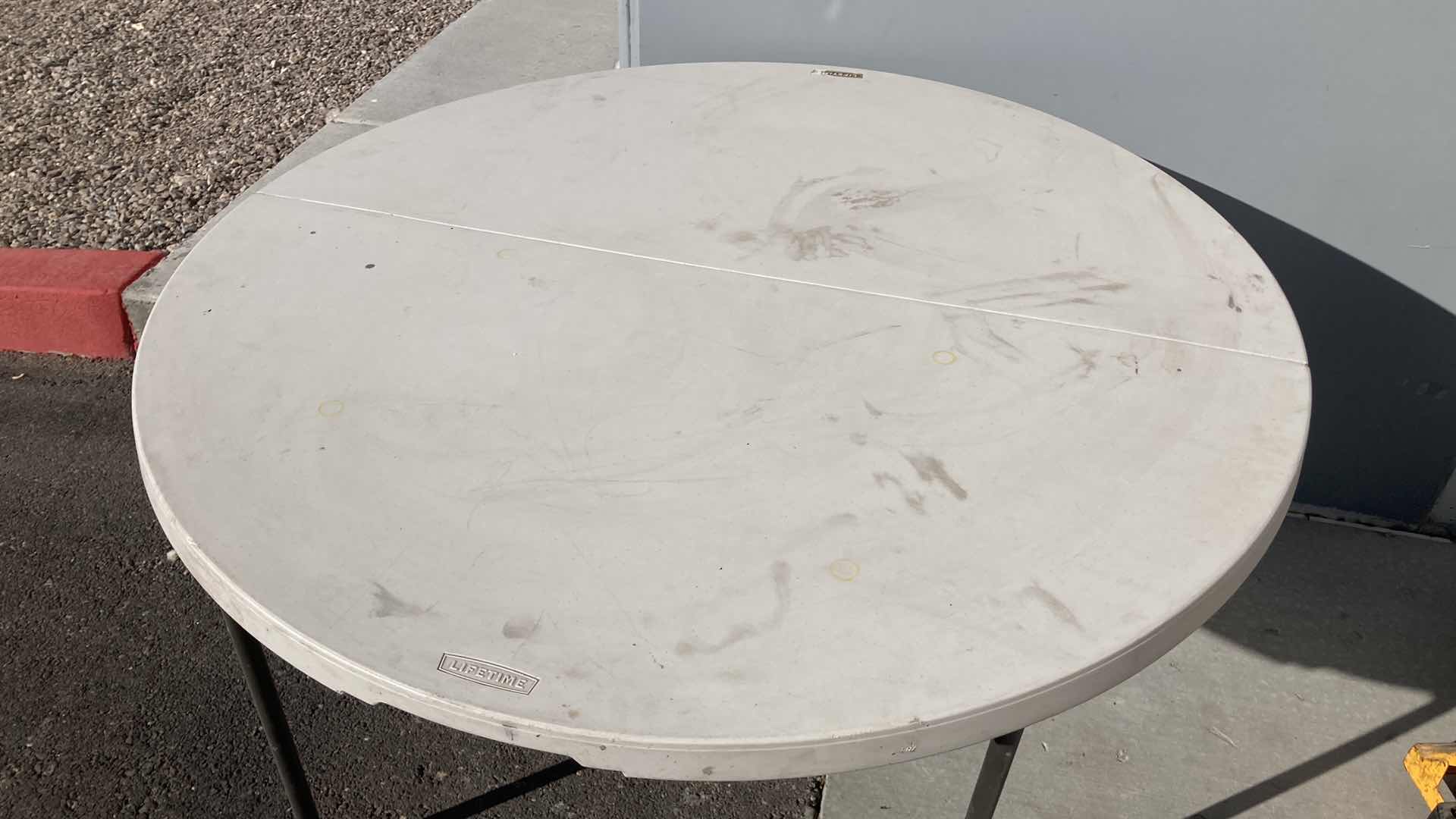 Photo 1 of LIFETIME ROUND FOLDING TABLE 47.5” X 29”