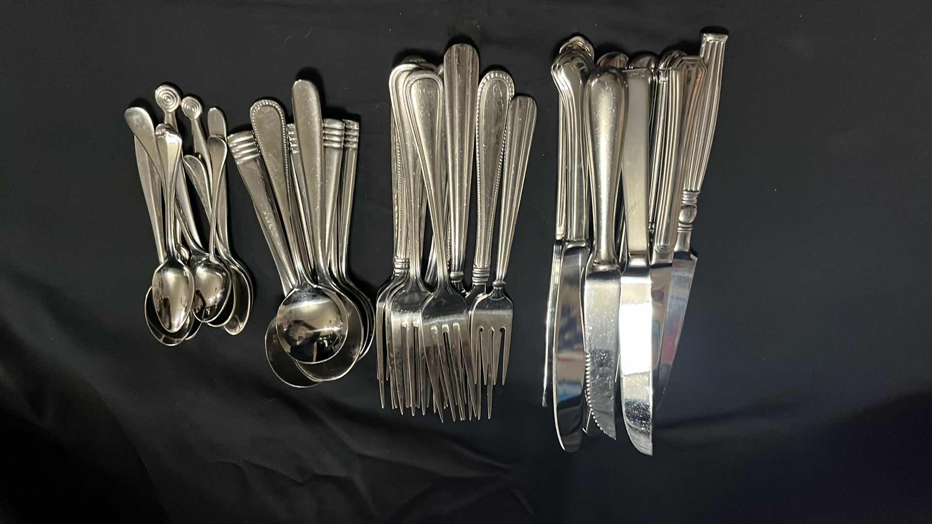 Photo 1 of STAINLESS STEEL FLATWARE, VARIOUS STYLES IN EACH UTENSIL, 10 OF EACH, 4.25” - 9.25” (40 PCS)