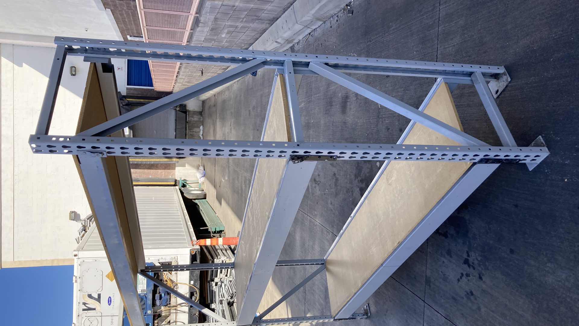 Photo 1 of MADIX HEAVY DUTY STEEL RACK W PARTICLE BOARD SHELVES 102” X 23” H 85”