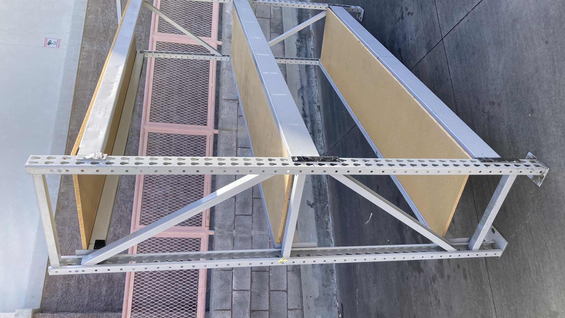 Photo 1 of MADIX HEAVY DUTY STEEL RACK W PARTICLE BOARD SHELVES 102” X 23” H 85”