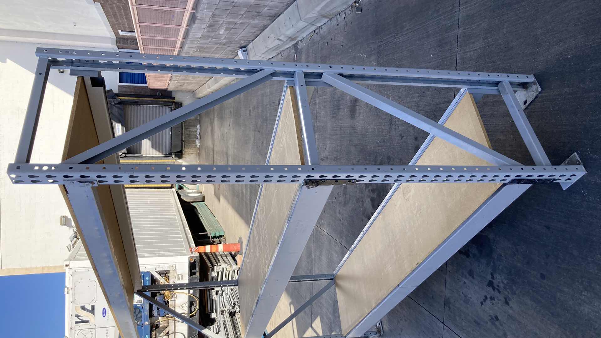 Photo 1 of MADIX HEAVY DUTY STEEL RACK W PARTICLE BOARD SHELVES 102” X 23” H 85”