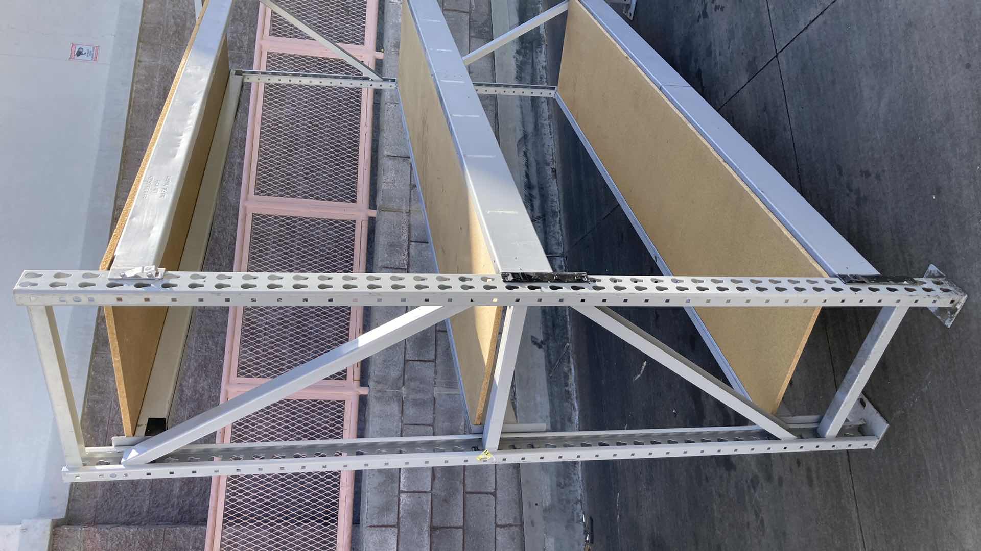 Photo 1 of MADIX HEAVY DUTY STEEL RACK W PARTICLE BOARD SHELVES 102” X 23” H 85”