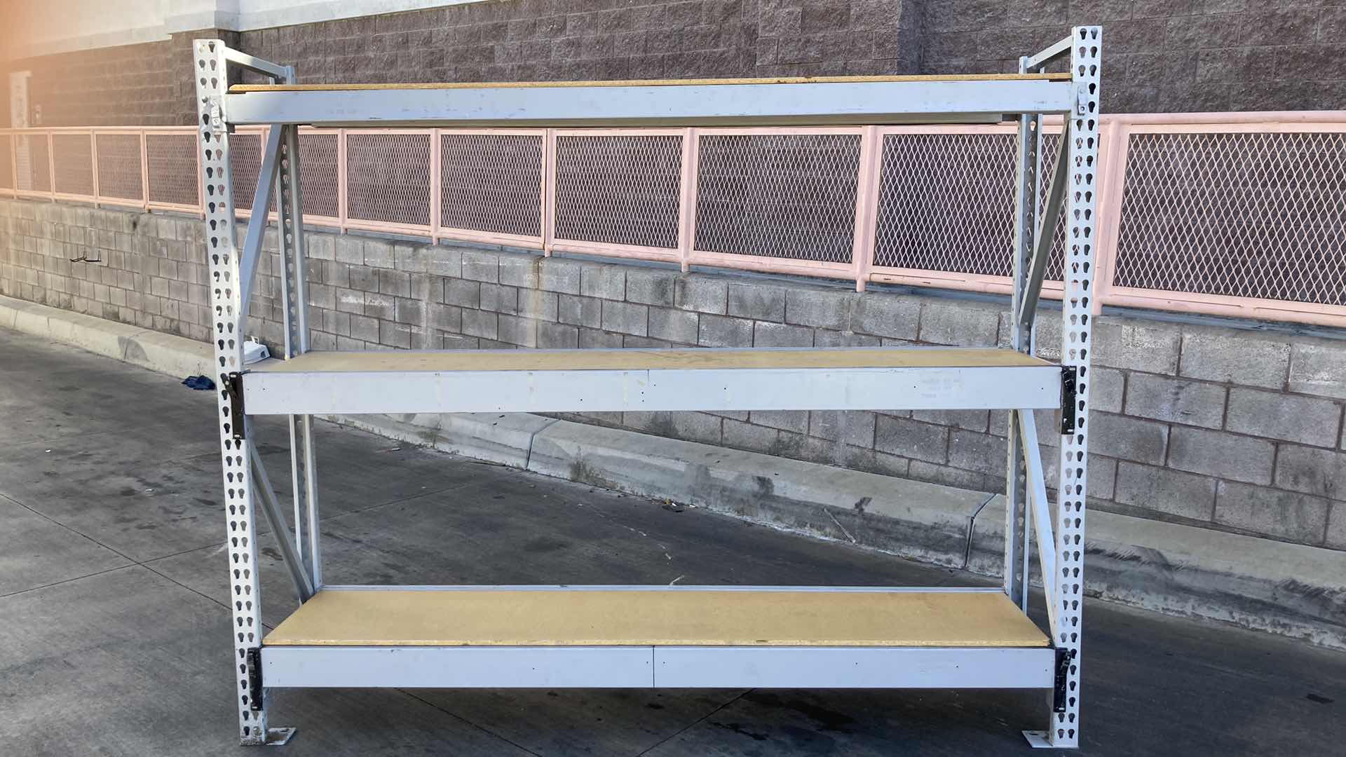 Photo 1 of MADIX HEAVY DUTY STEEL RACK W PARTICLE BOARD SHELVES 102” X 23” H 85”