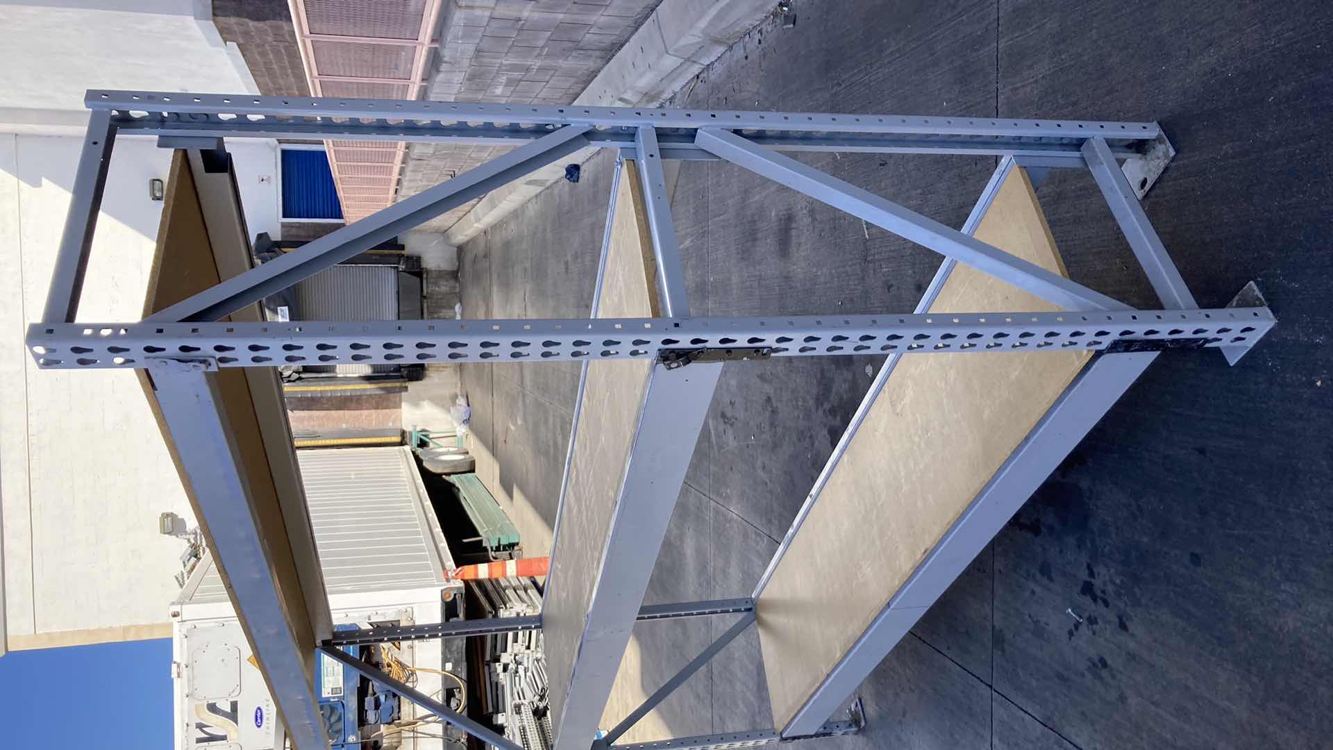 Photo 1 of MADIX HEAVY DUTY STEEL RACK W PARTICLE BOARD SHELVES 102” X 23” H 85”