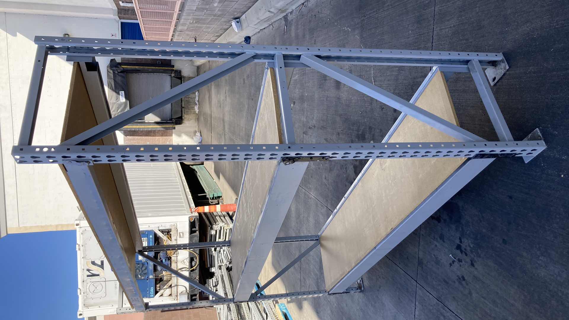 Photo 1 of MADIX HEAVY DUTY STEEL RACK W PARTICLE BOARD SHELVES 102” X 23” H 85”