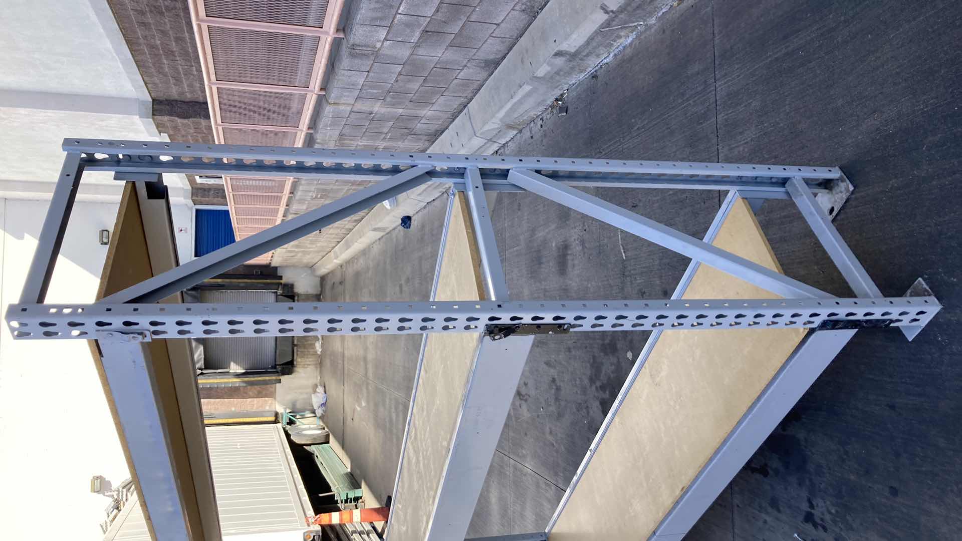 Photo 1 of MADIX HEAVY DUTY STEEL RACK W PARTICLE BOARD SHELVES 102” X 23” H 85”