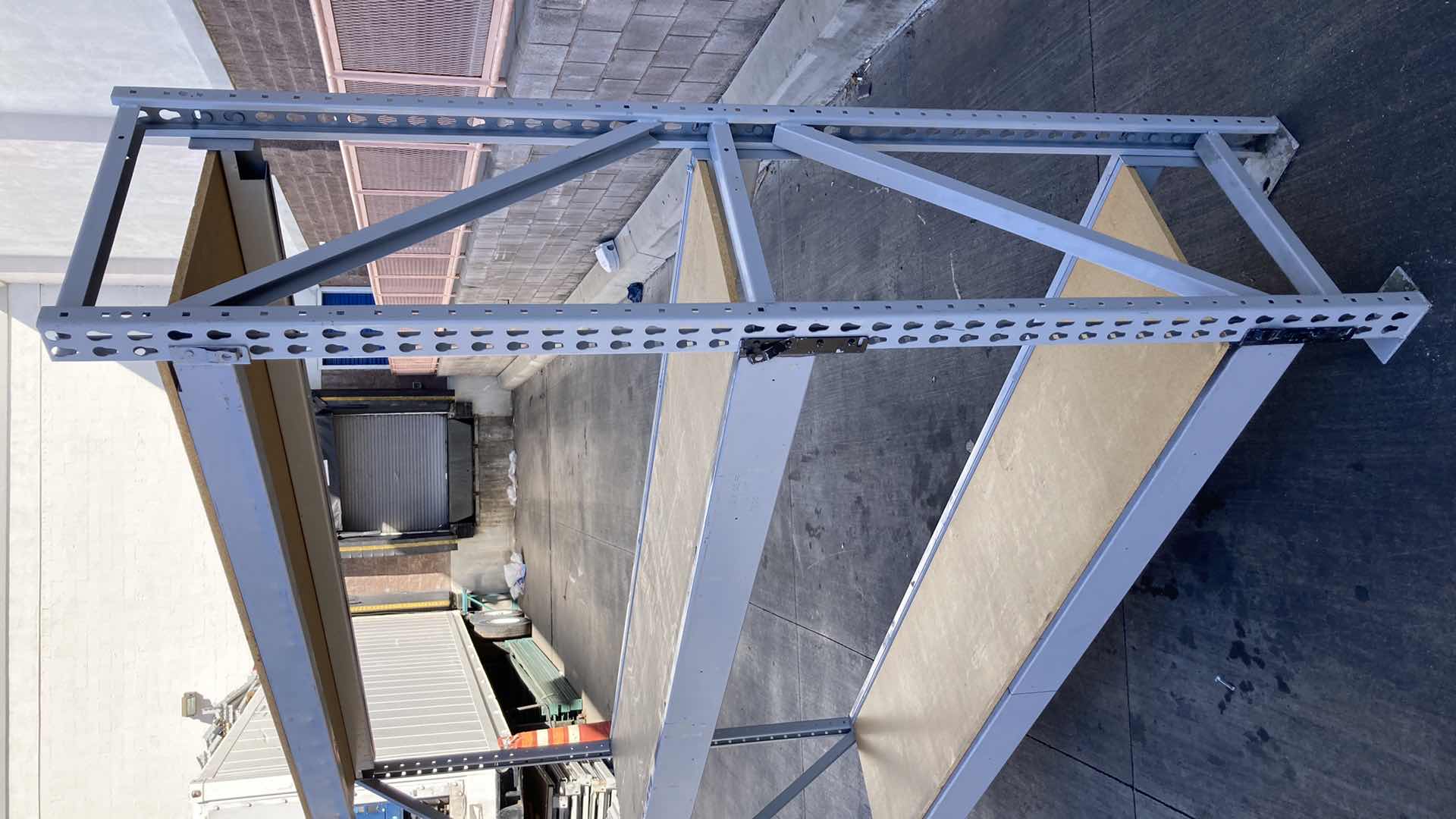 Photo 1 of MADIX HEAVY DUTY STEEL RACK W PARTICLE BOARD SHELVES 102” X 23” H 85”