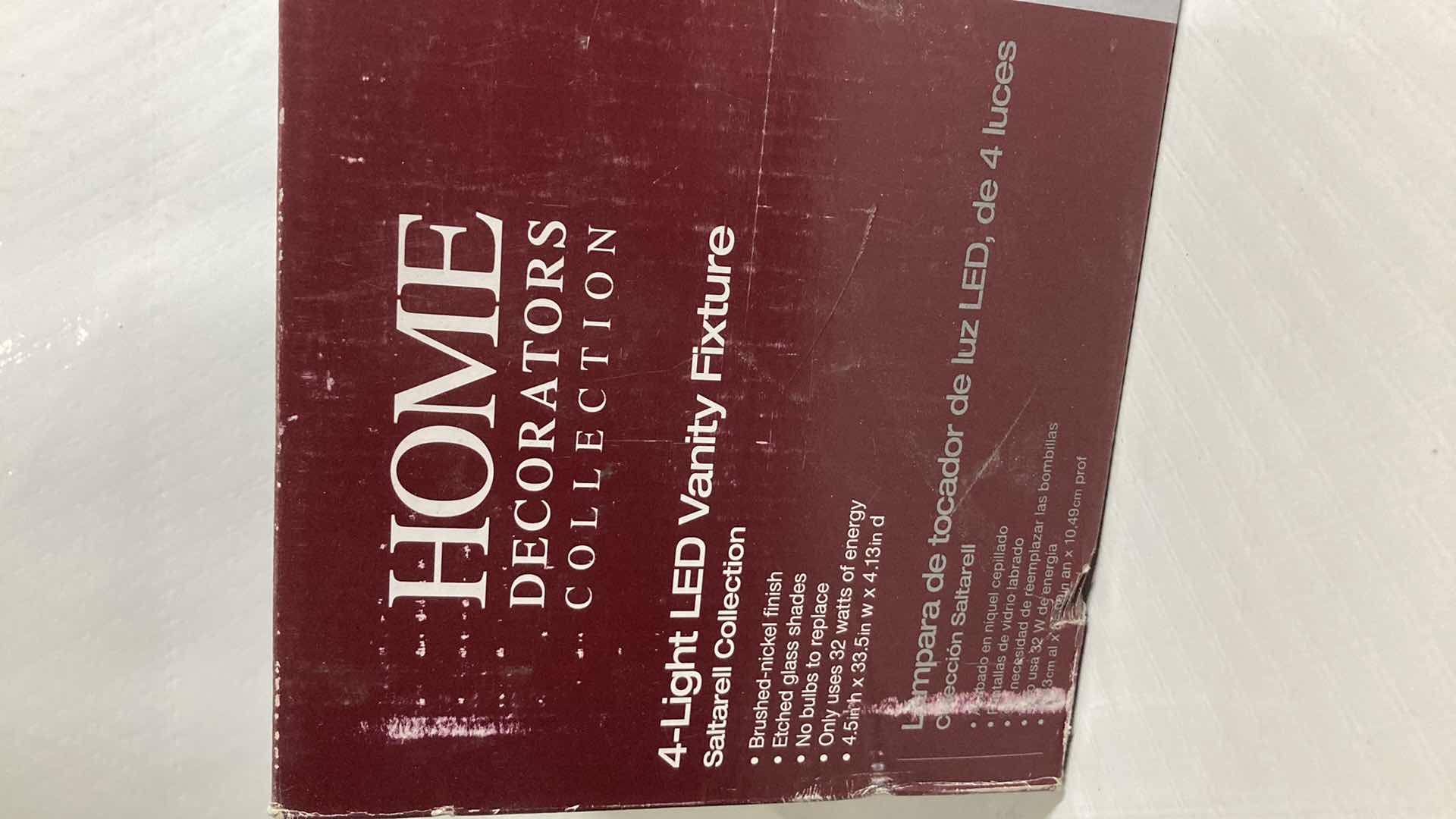 Photo 1 of NEW HOME DECORATORS SALTARELL BRUSHED NICKEL FINISH ETCHED GLASS LED 4 LIGHT VANITY FIXTURE MODEL 1001844652