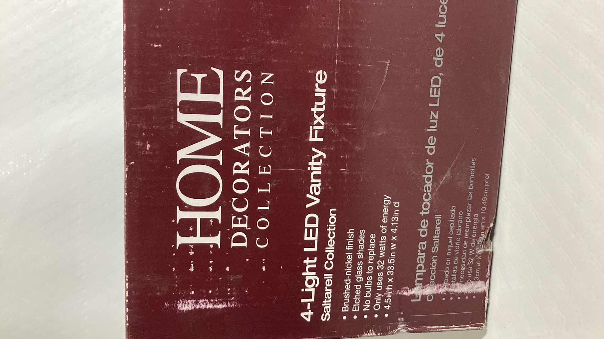 Photo 1 of NEW HOME DECORATORS SALTARELL BRUSHED NICKEL FINISH ETCHED GLASS LED 4 LIGHT VANITY FIXTURE MODEL 1001844652