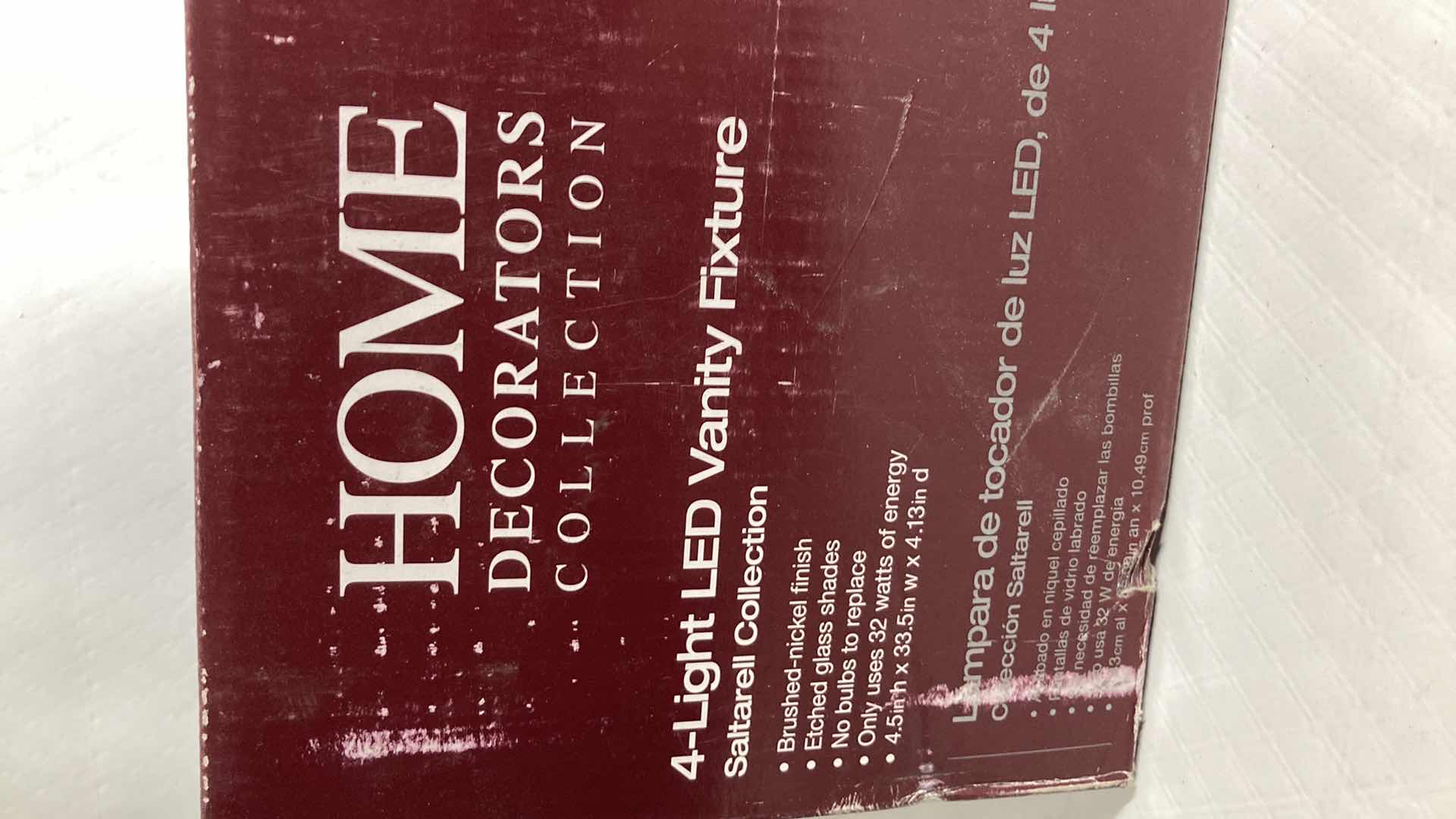 Photo 1 of NEW HOME DECORATORS SALTARELL BRUSHED NICKEL FINISH ETCHED GLASS LED 4 LIGHT VANITY FIXTURE MODEL 1001844652