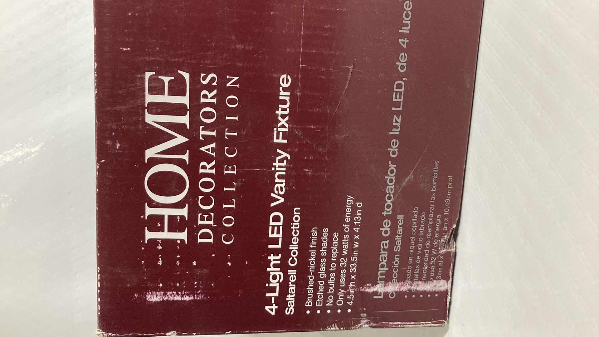 Photo 1 of NEW HOME DECORATORS SALTARELL BRUSHED NICKEL FINISH ETCHED GLASS LED 4 LIGHT VANITY FIXTURE MODEL 1001844652