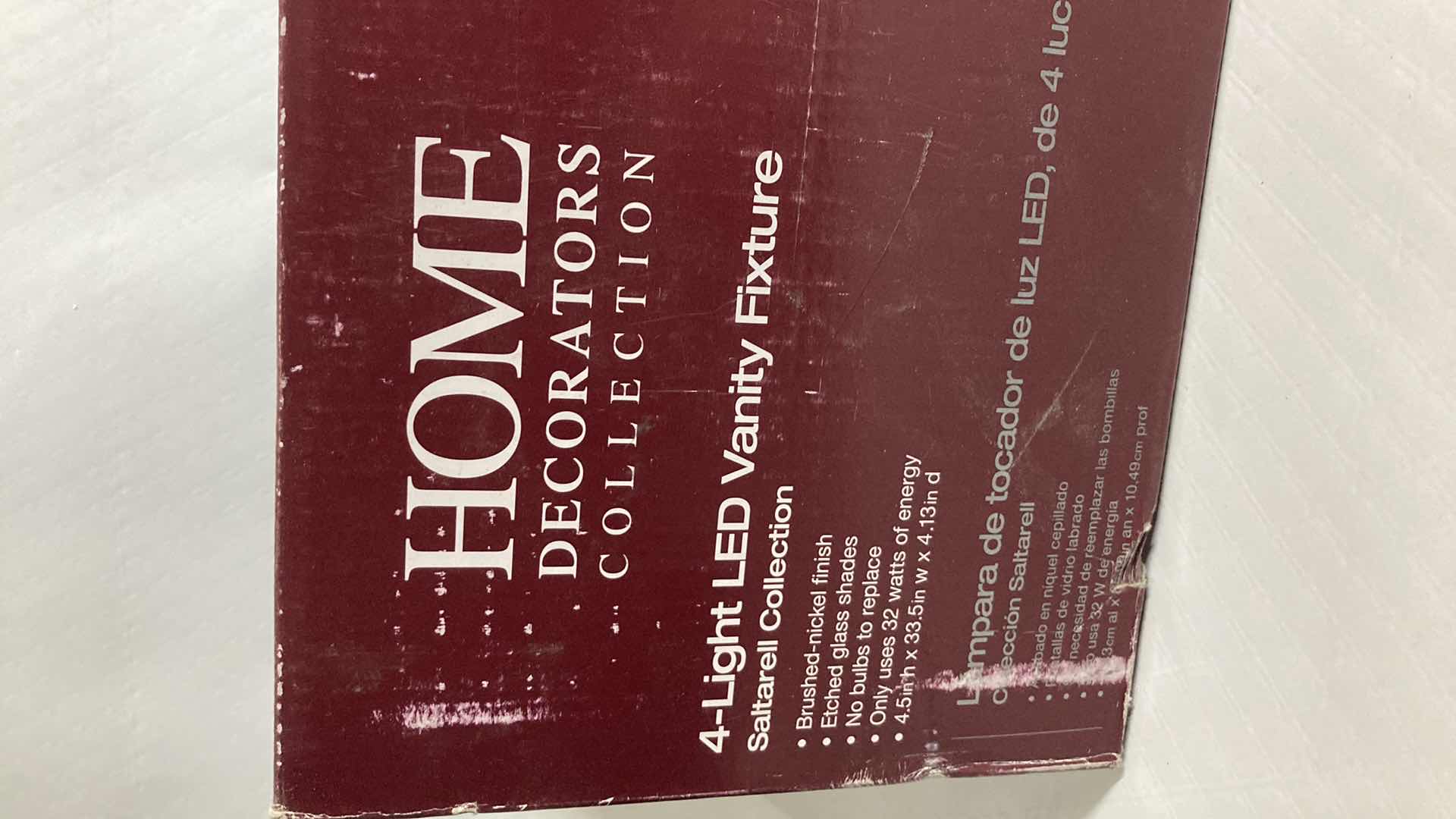 Photo 1 of NEW HOME DECORATORS SALTARELL BRUSHED NICKEL FINISH ETCHED GLASS LED 4 LIGHT VANITY FIXTURE MODEL 1001844652