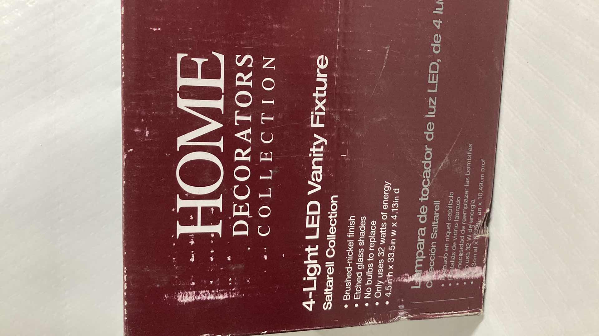 Photo 1 of NEW HOME DECORATORS SALTARELL BRUSHED NICKEL FINISH ETCHED GLASS LED 4 LIGHT VANITY FIXTURE MODEL 1001844652