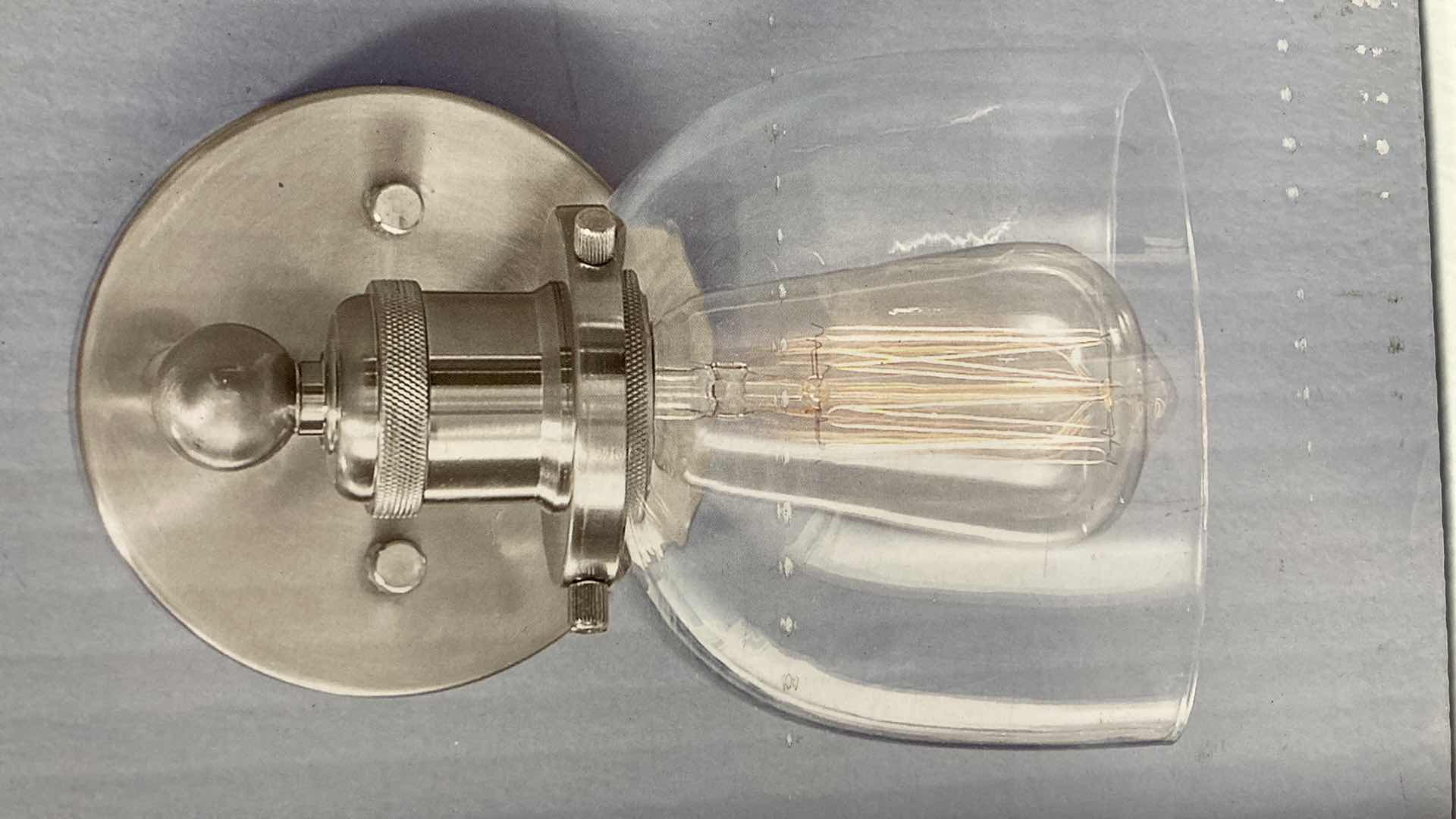 Photo 1 of NEW HOME DECORATORS EVELYN BRUSHED NICKEL FINISH CLEAR GLASS 1 LIGHT WALL SCONCE MODEL 1004693630