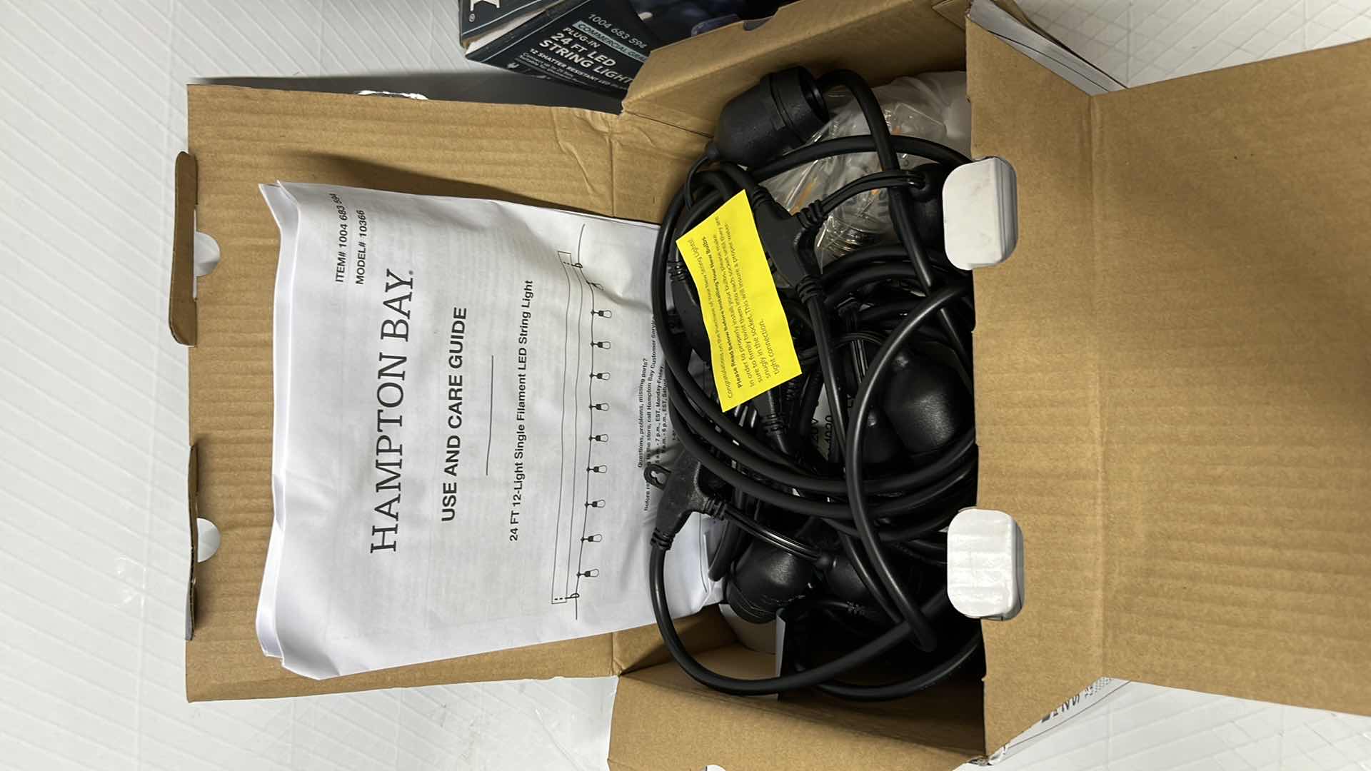 Photo 1 of 2- HAMPTON BAY 24 FT COMMERCIAL GRADE LED PLUG-IN STRING LIGHTS W 12 SHATTER RESISTANT FILAMENT BULBS (1004683594)