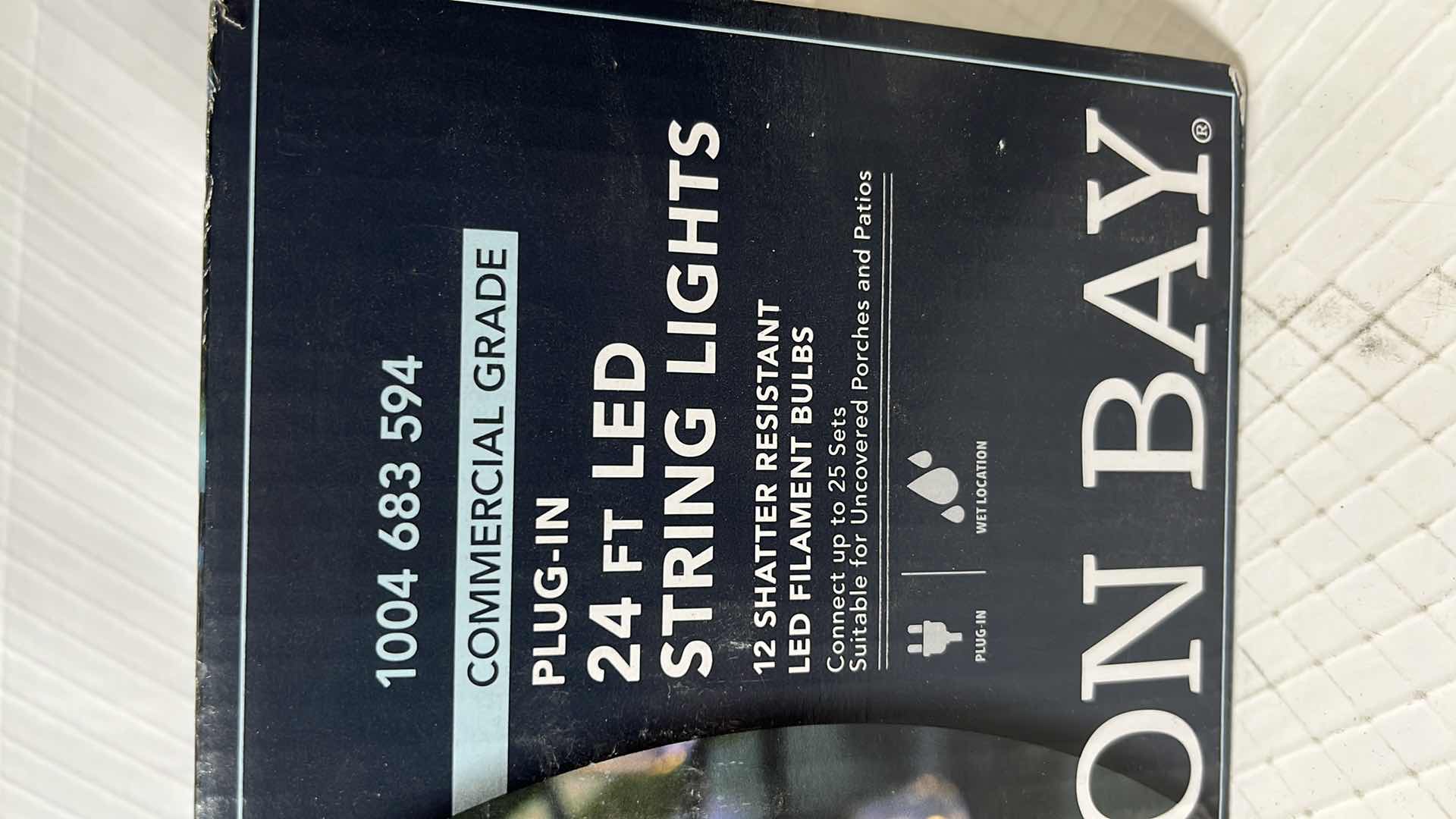 Photo 1 of 2- HAMPTON BAY 24 FT COMMERCIAL GRADE LED PLUG-IN STRING LIGHTS W 12 SHATTER RESISTANT FILAMENT BULBS (1004683594)