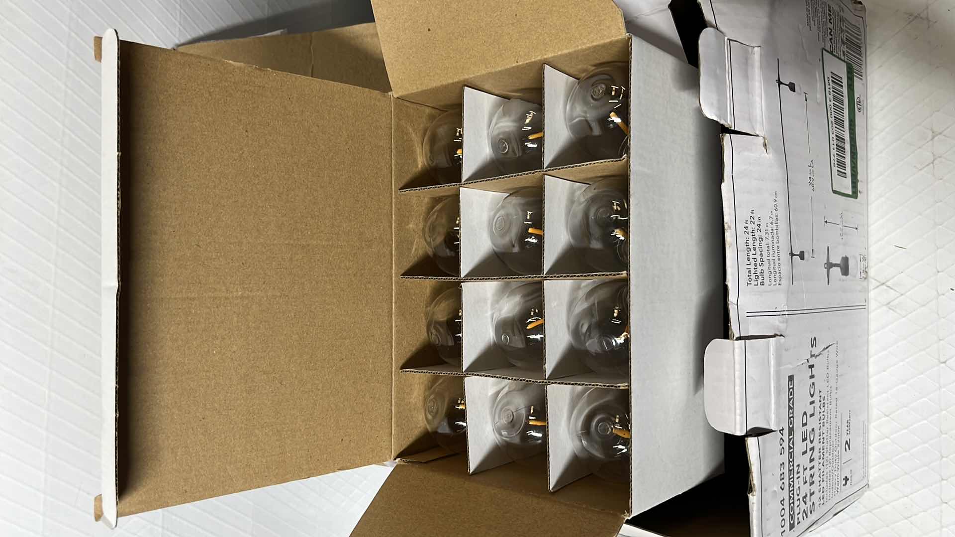 Photo 1 of 2- HAMPTON BAY 24 FT COMMERCIAL GRADE LED PLUG-IN STRING LIGHTS W 12 SHATTER RESISTANT FILAMENT BULBS (1004683594)