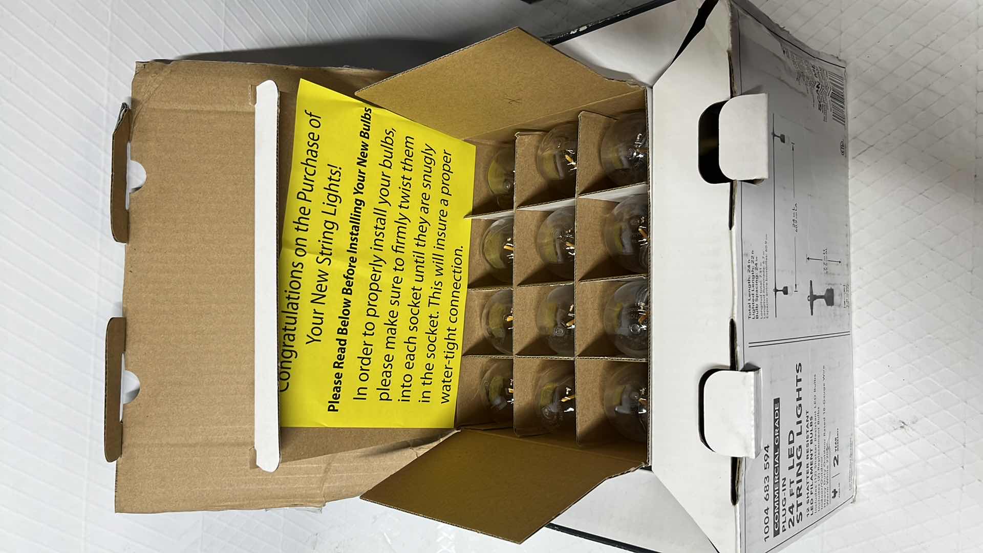 Photo 1 of 2- HAMPTON BAY 24 FT COMMERCIAL GRADE LED PLUG-IN STRING LIGHTS W 12 SHATTER RESISTANT FILAMENT BULBS (1004683594)