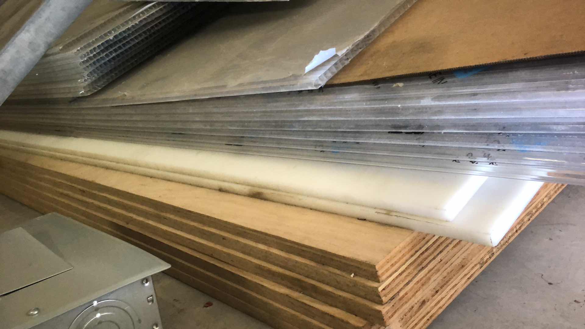 Photo 1 of ASSORTMENT OF MATERIALS SHEET PLASTIC, METAL, PLYWOOD, PLEXIGLASS