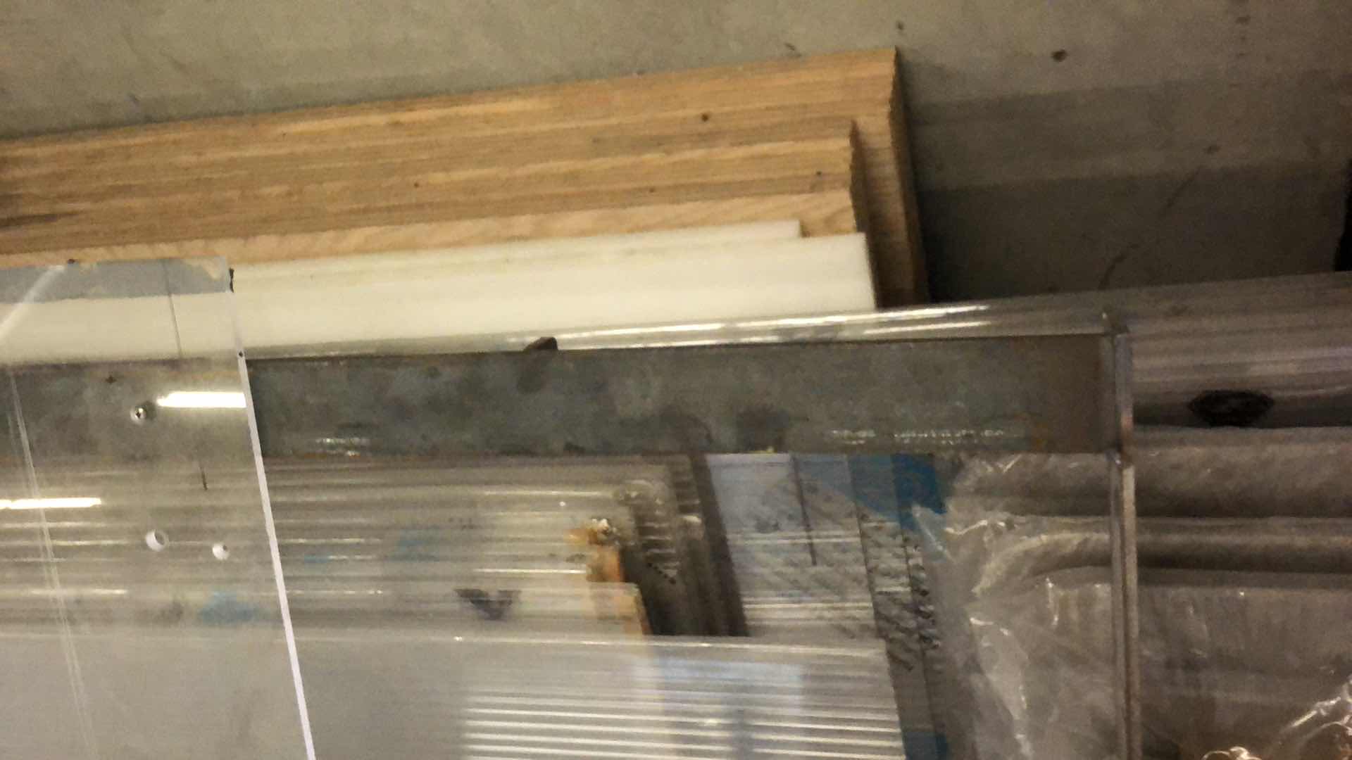 Photo 1 of ASSORTMENT OF MATERIALS SHEET PLASTIC, METAL, PLYWOOD, PLEXIGLASS