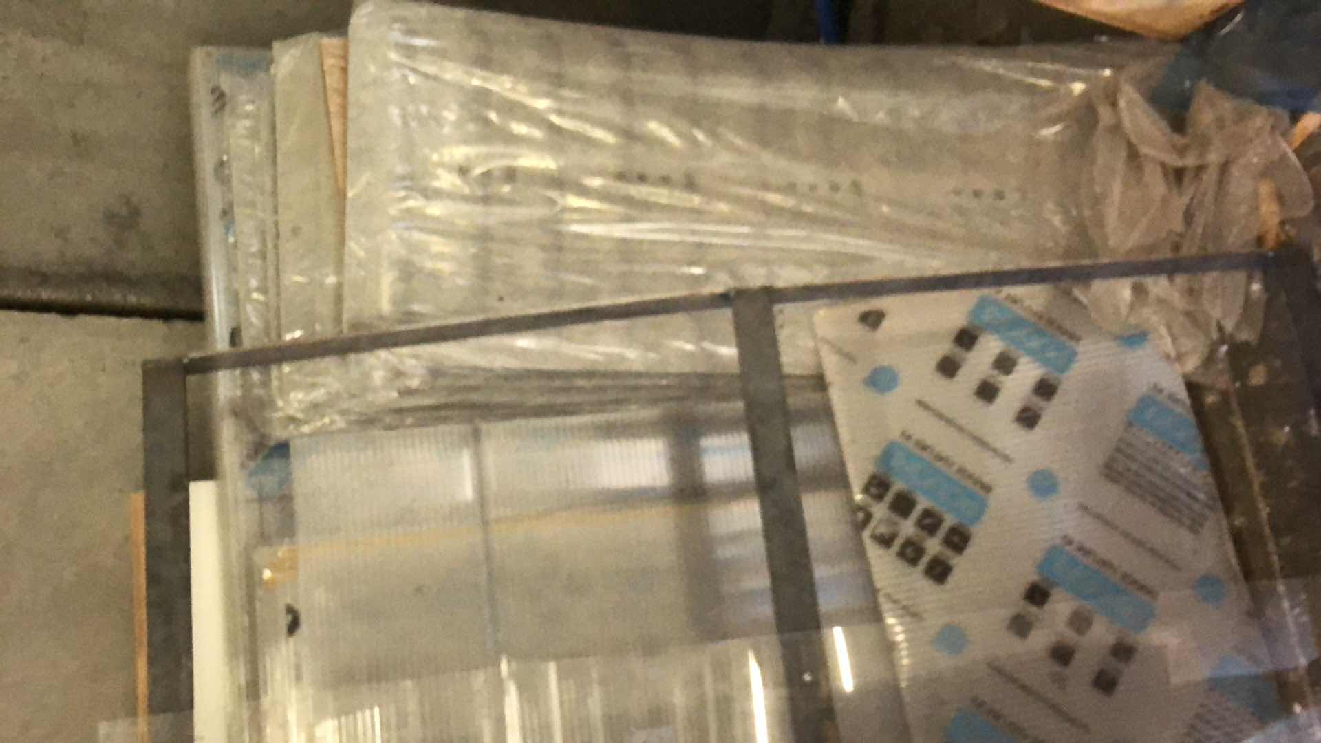 Photo 1 of ASSORTMENT OF MATERIALS SHEET PLASTIC, METAL, PLYWOOD, PLEXIGLASS