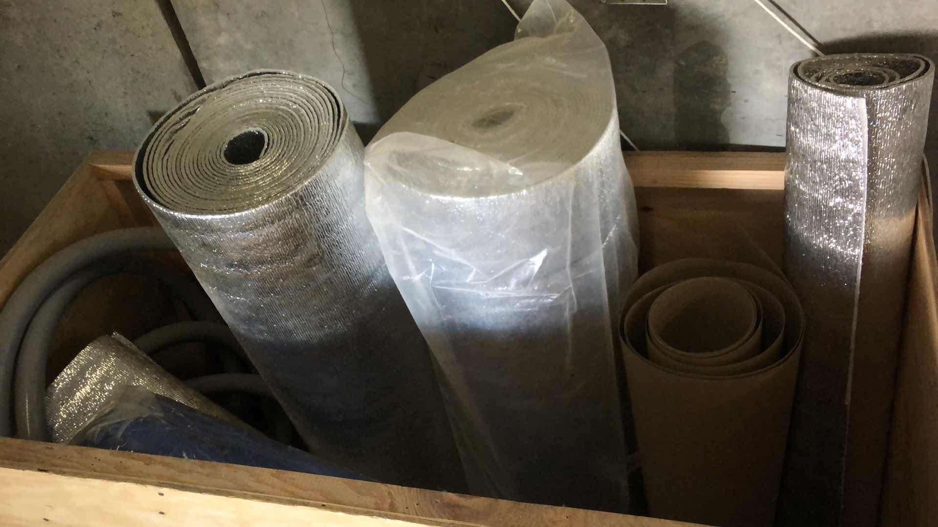 Photo 1 of ASSORTED INSULATING MATERIAL RUBBER HOSE AND LARGE PLASTIC VESSEL CRATE INCLUDED
