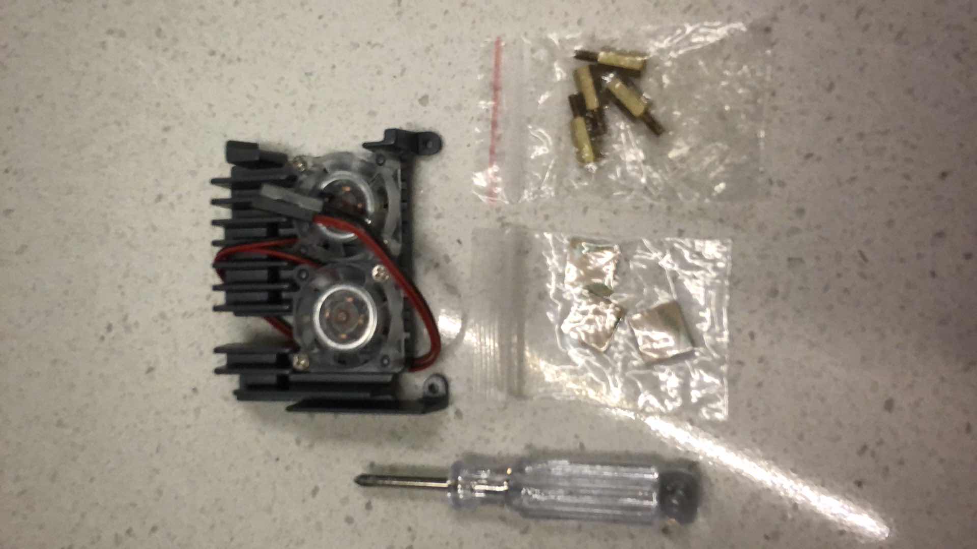 Photo 1 of ASSORTED PARTS FOR RASPBERRY PI CAMERA KITS: APPROX 50 UNISTORM ALLOY CASES, 10 LABIST PLASTIC CASES, 70 MICRO USB AB CABLES, 25 TYPE C SWITCHING POWER CABLES, 15 DUAL FAN HEATSINKS, 20 TYPE C CARD READERS