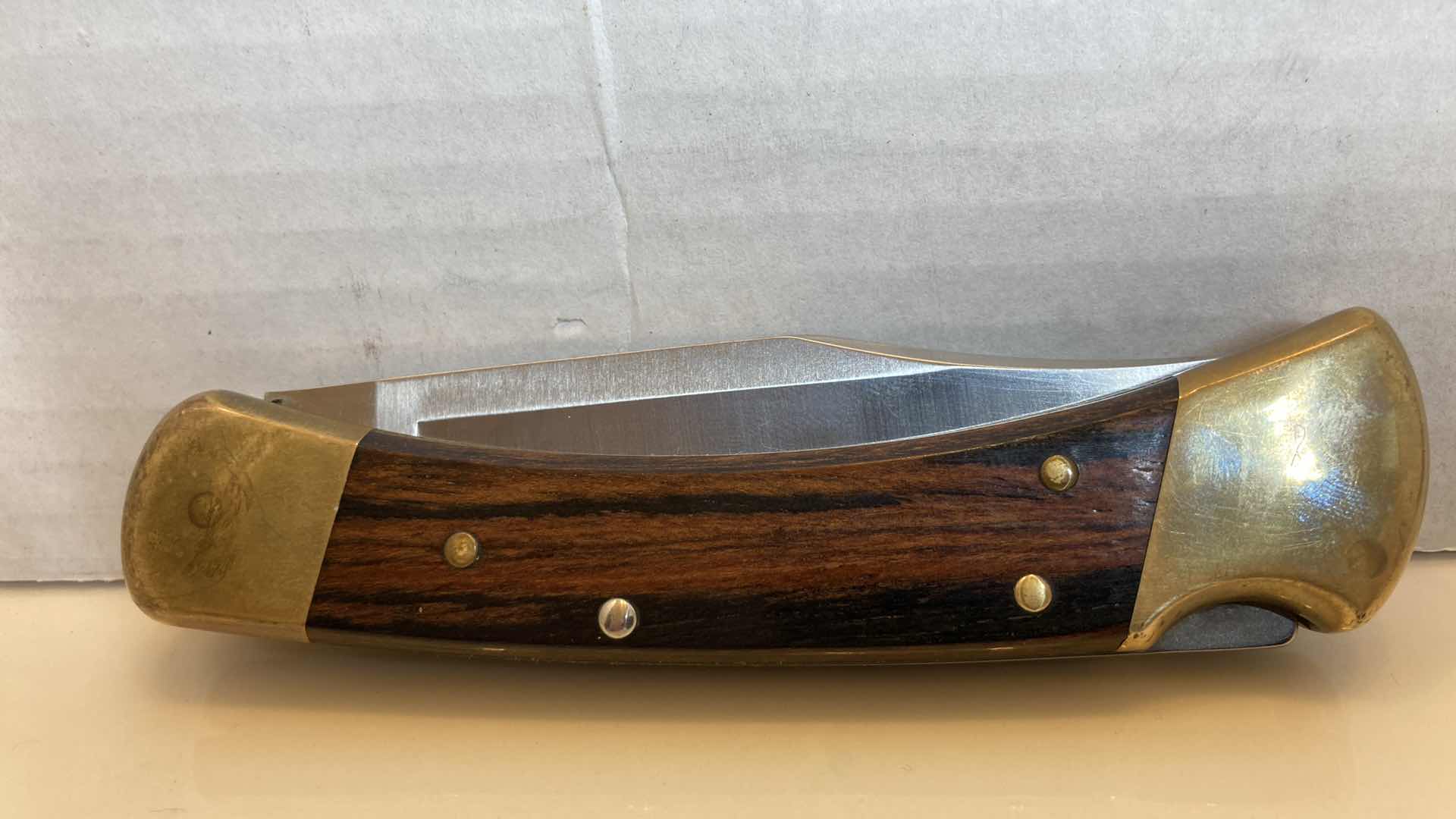 Photo 1 of BUCK 110 FOLDING KNIFE 3.75” W LEATHER SHEATH