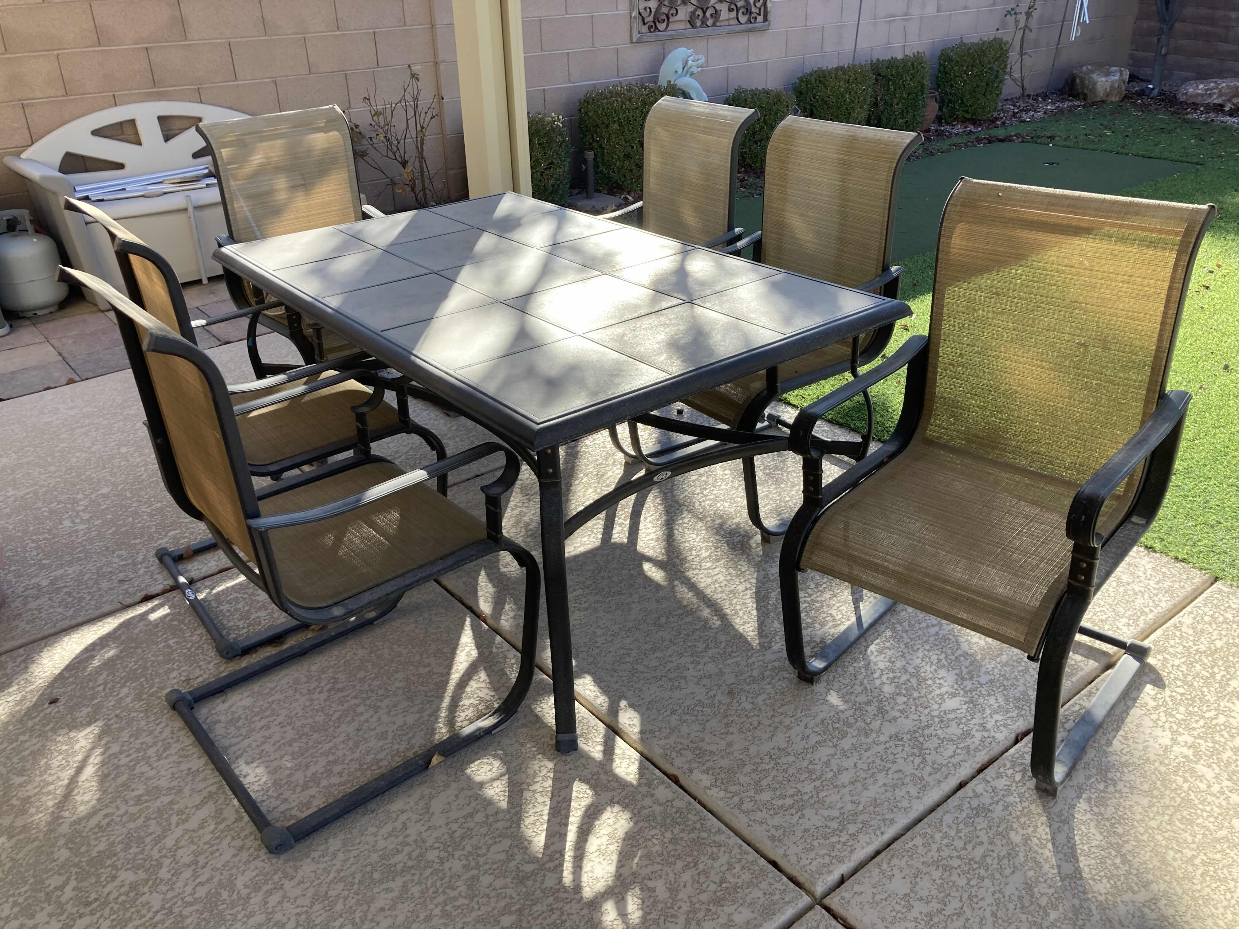 View 1 of HAMPTON BAY TILE TOP PATIO TABLE 64” X 40 H29” & 6 CHAIRS 22” X 24” H40”