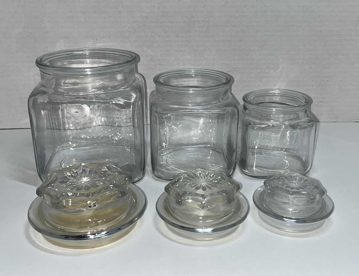 Photo 1 of CLEAR GLASS JAR SET W LIDS (3)
