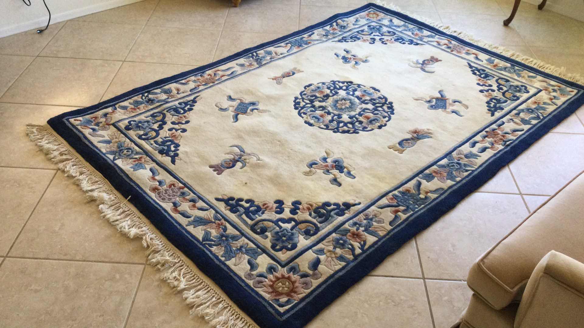 Photo 1 of BEIGE MULTI COLOR AREA RUG 96” X 66”