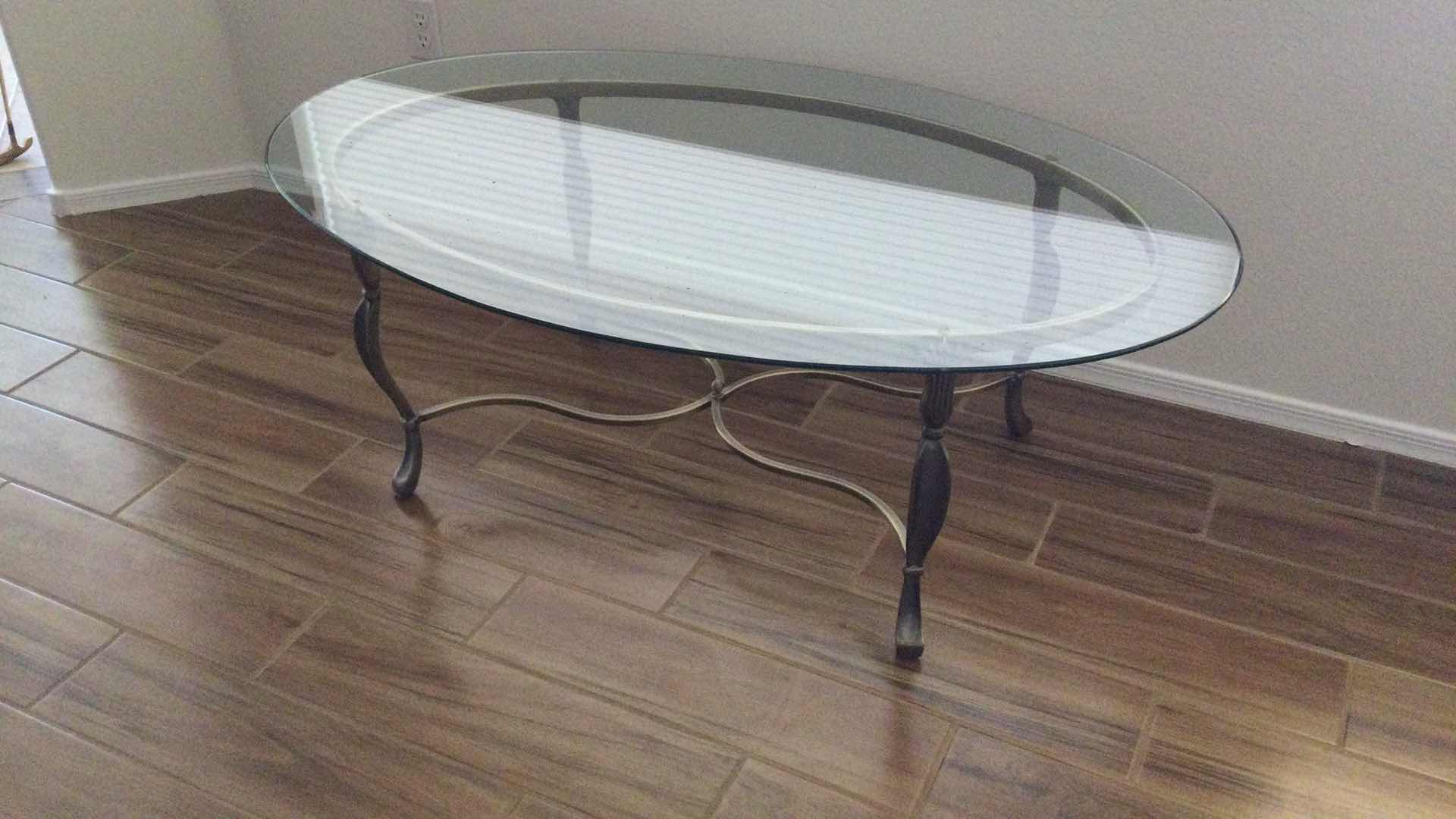 Photo 1 of COFFEE TABLE  SCULPTED METAL W/ GLASS TOP OVAL 52” X 33” H 18.5”