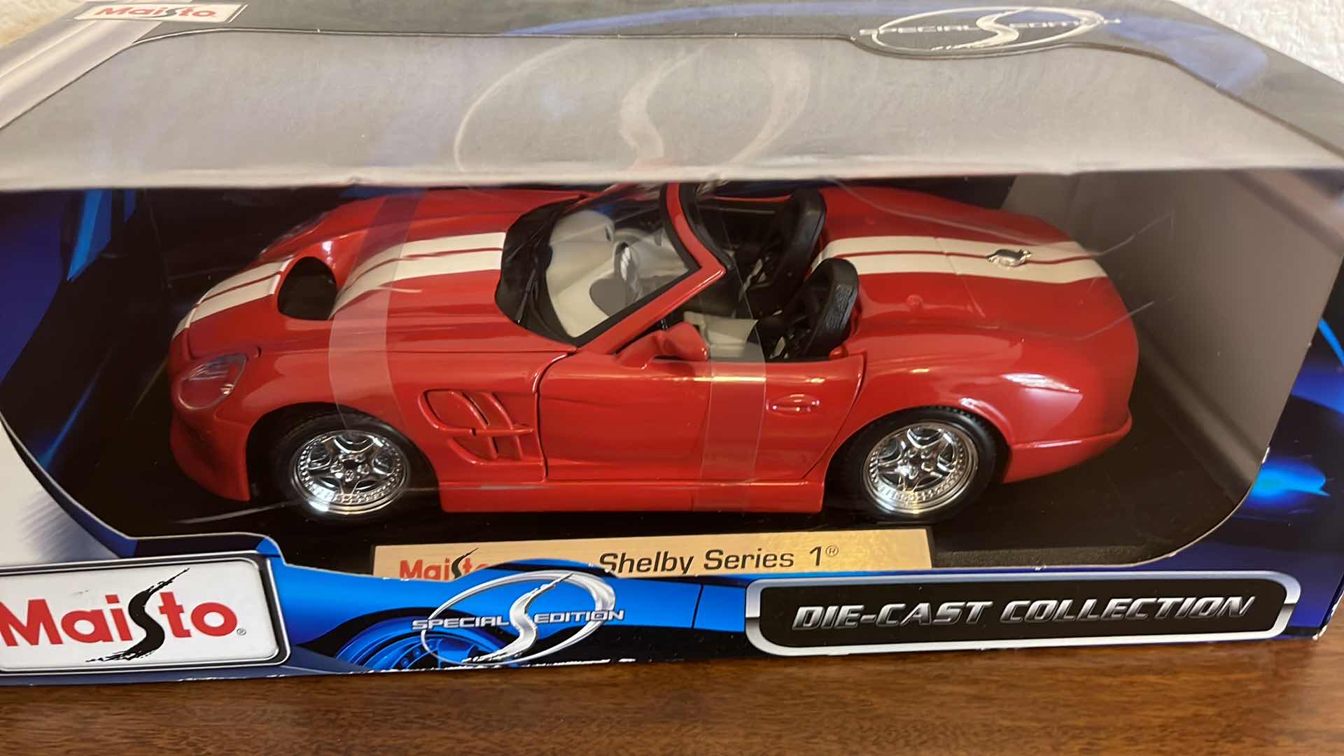 Photo 1 of MAISTO SHELBY SERIES 1 DIE CAST CAR IN BOX