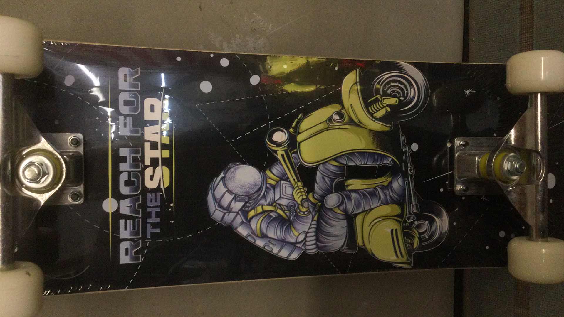 Photo 1 of NEW PHNHOLUN SKATE BOARD (REACH FOR THE STARS) 31” X 8”