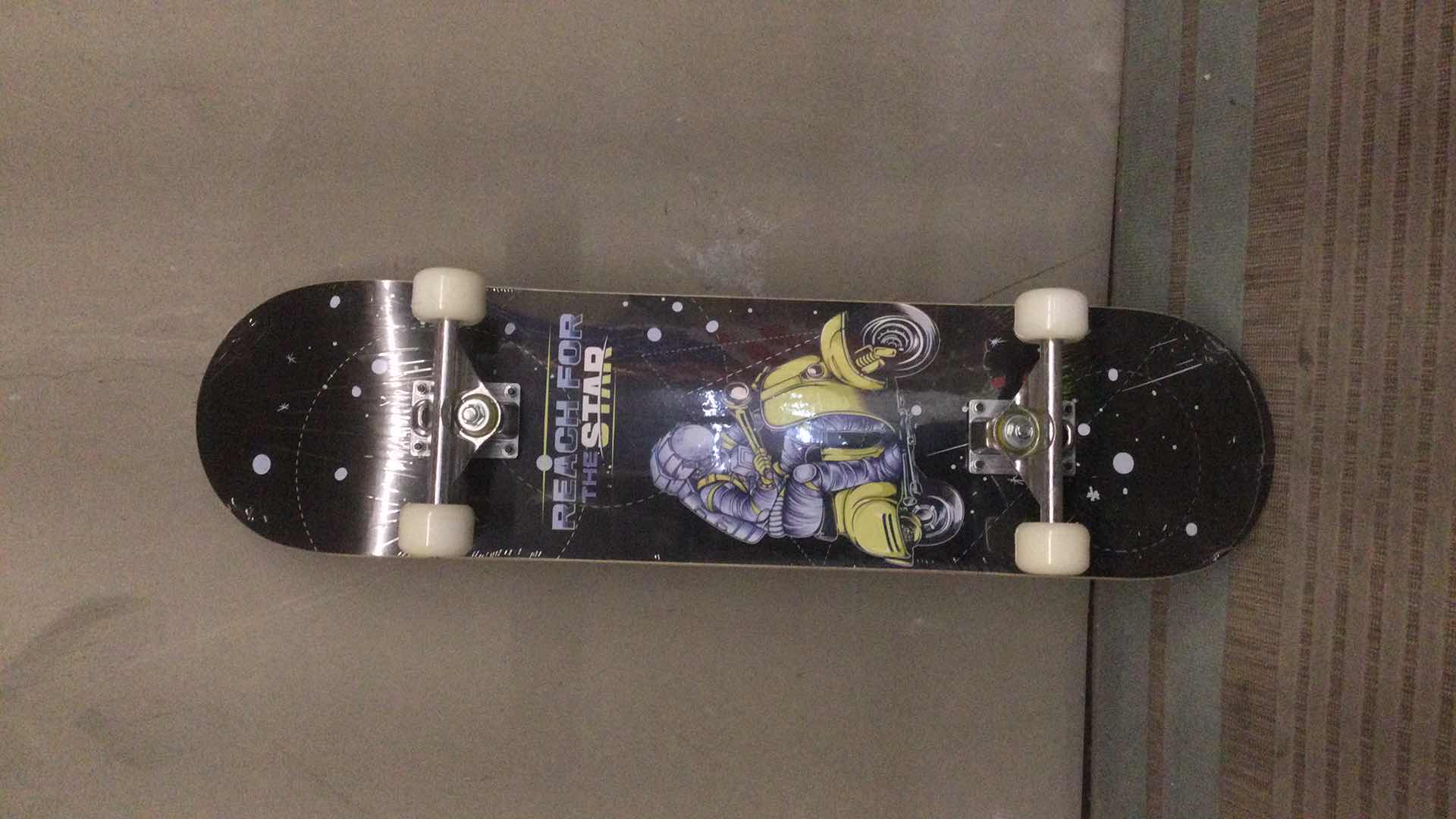 Photo 3 of NEW PHNHOLUN SKATE BOARD ( REACH FOR THE STARS) 31” X 8”