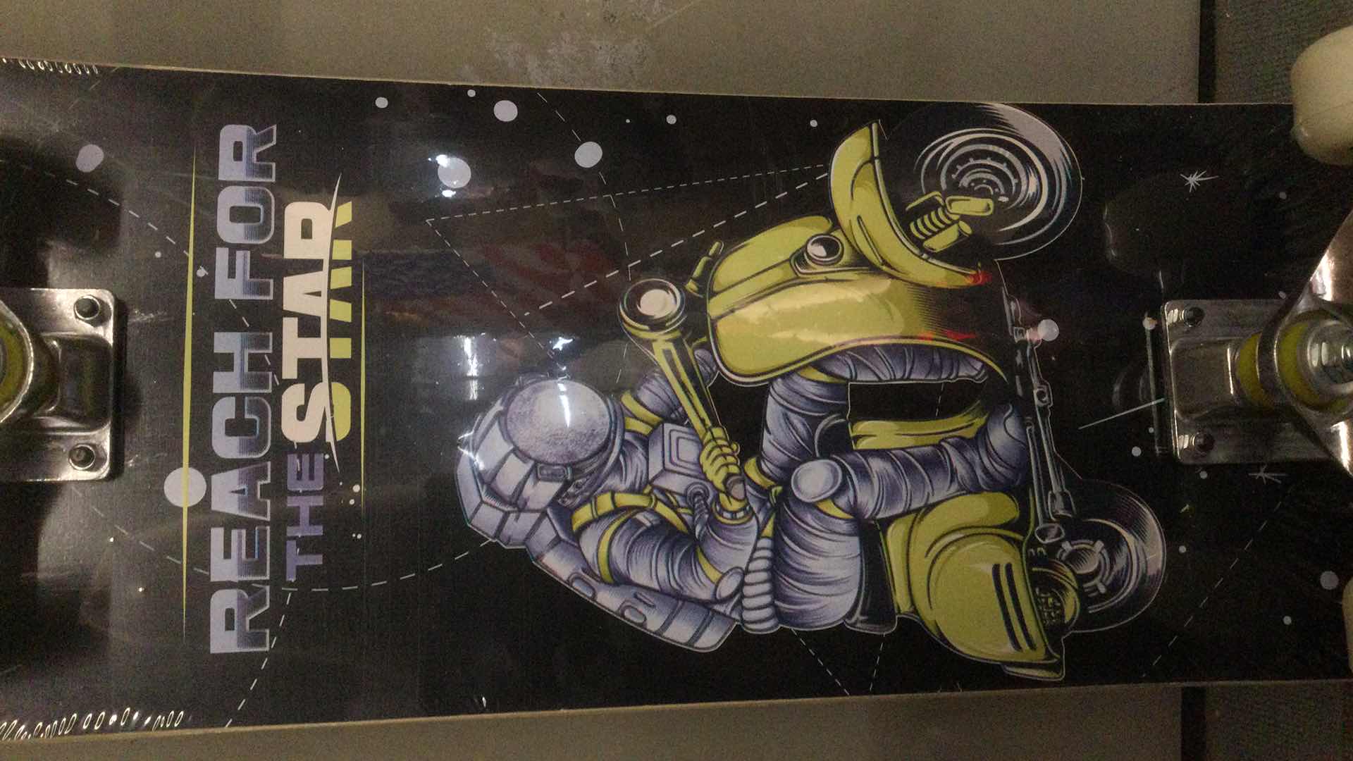 Photo 1 of NEW PHNHOLUN SKATE BOARD ( REACH FOR THE STARS) 31” X 8”