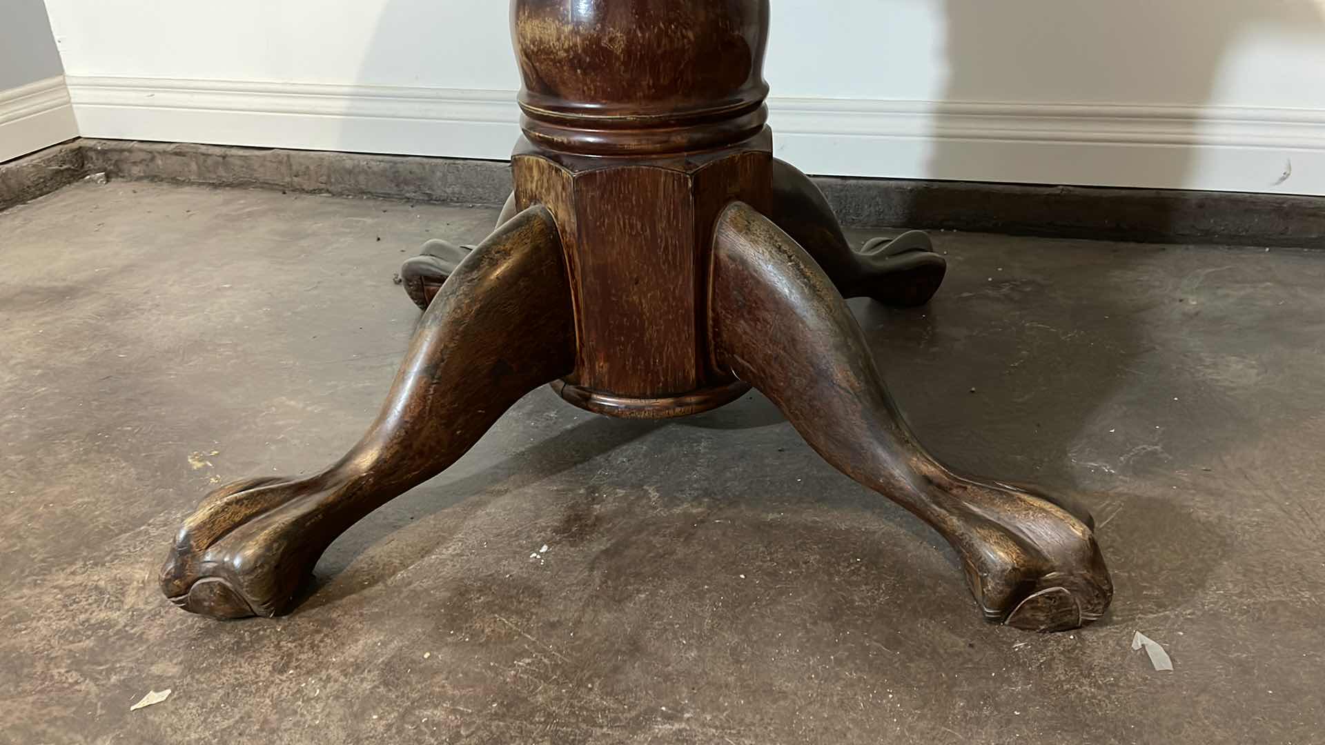 Photo 1 of VINTAGE SOLID WOOD CLAW FOOT TABLE 48” H 30”