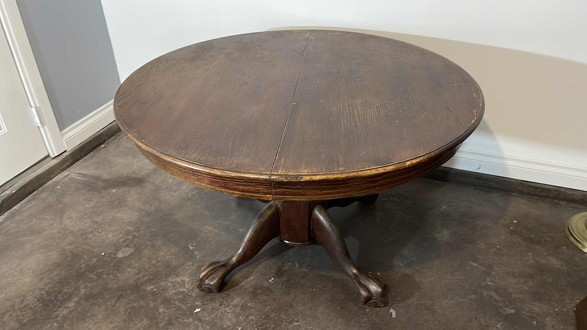 Photo 1 of VINTAGE SOLID WOOD CLAW FOOT TABLE 48” H 30”