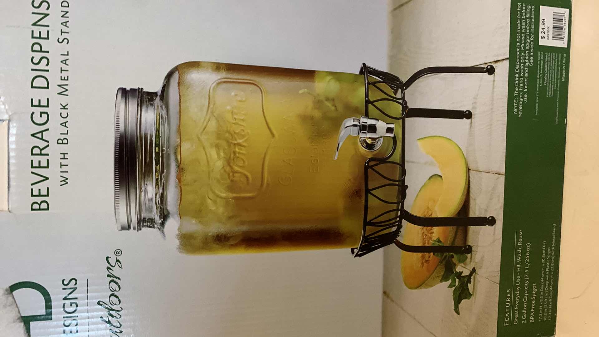 Photo 1 of BEVERAGE DISPENSER W BLACK METAL STAND