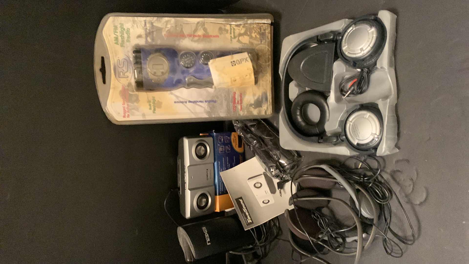 Photo 1 of ELECTRONICS ASSORTMENT, FLASHLIGHT RADIO, WIRELESS HEADPHONES, TRAVEL SOUND AND MORE